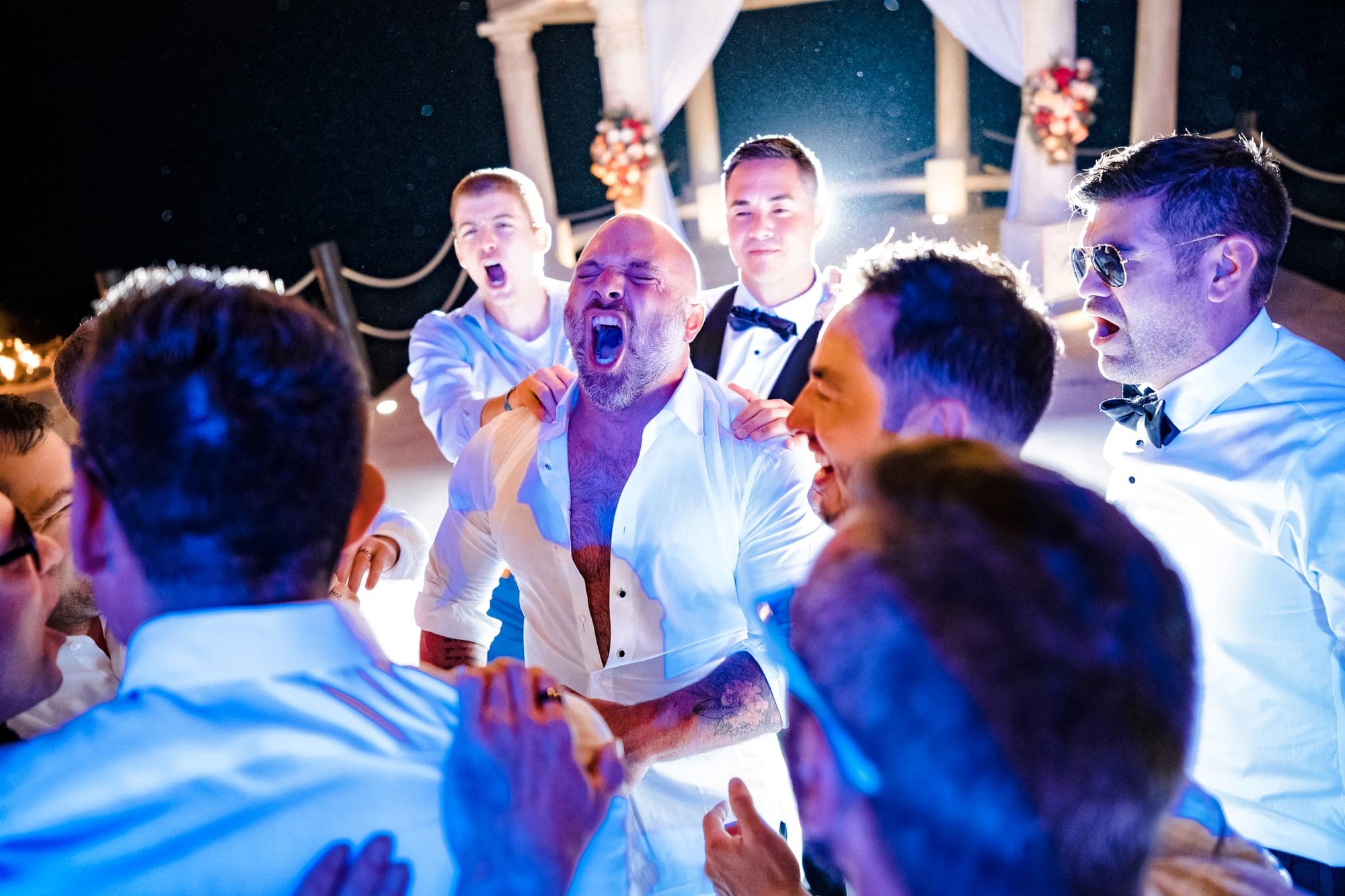 Guests celebrating Tina and David on the open-air reception dance floor in Cabo