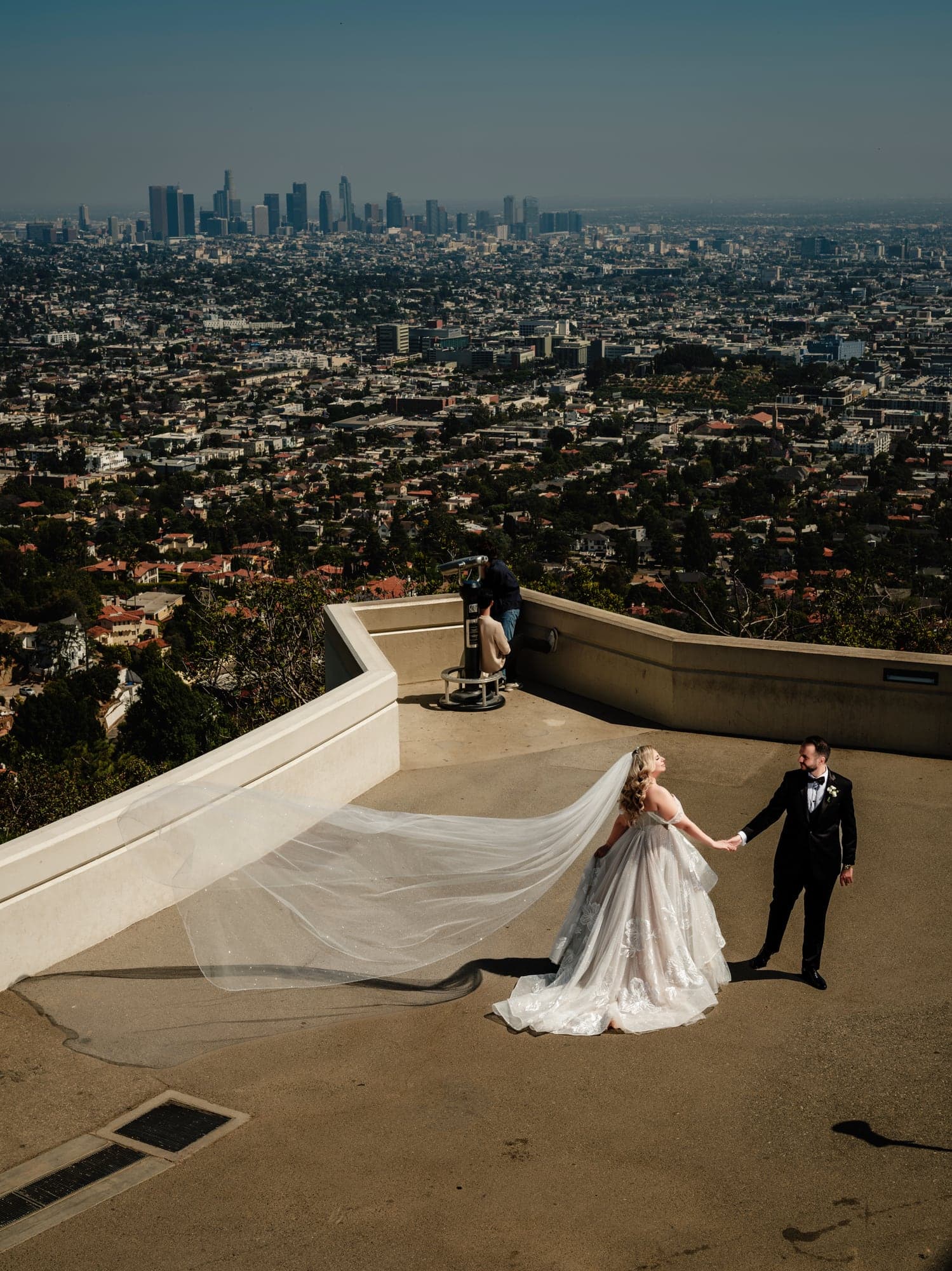 Eliz and Haig standing above Los Angeles during their Griffith Observatory portrait session