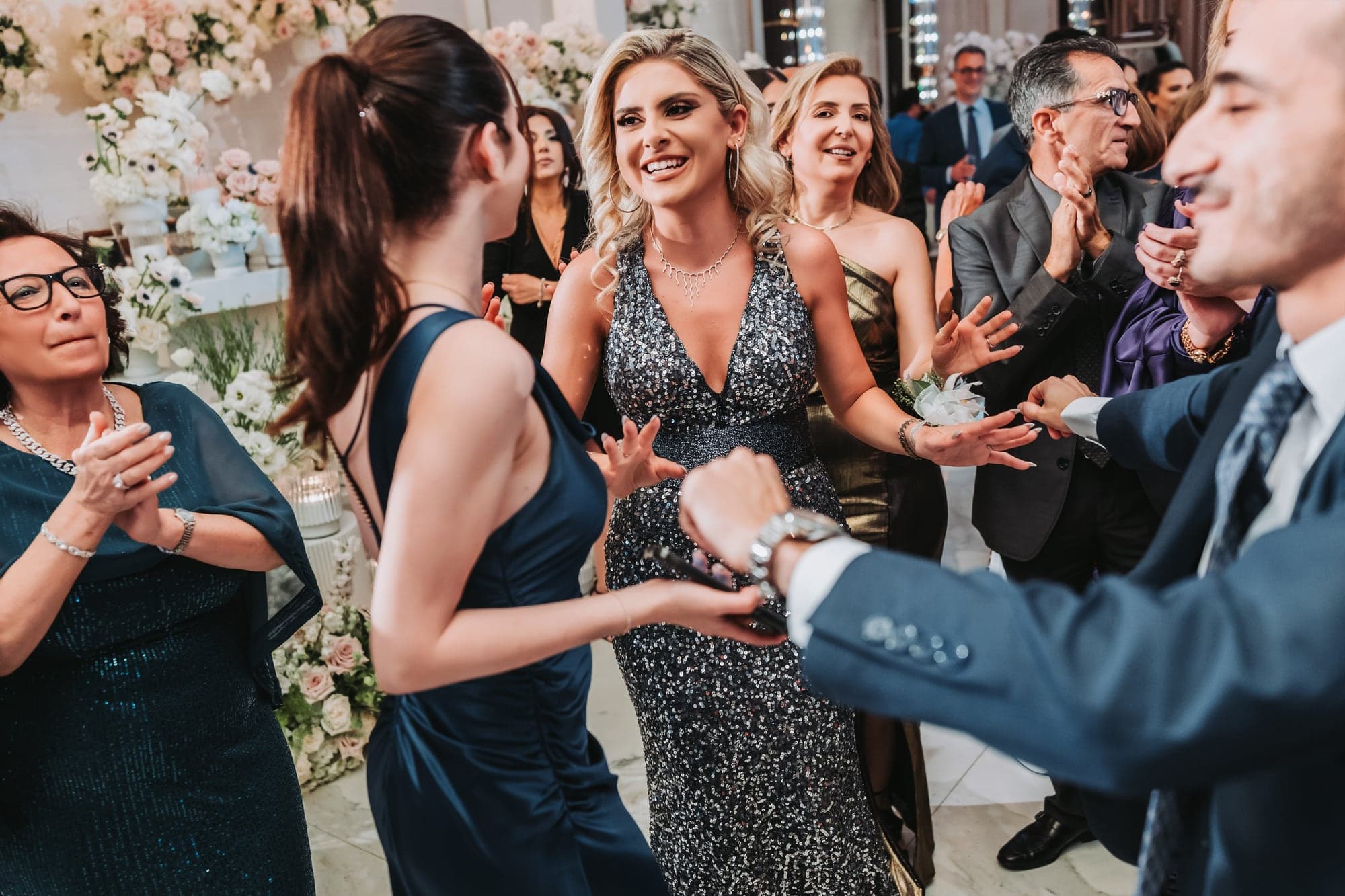 Eliz and Haig celebrating with guests on the Grand Venue dance floor