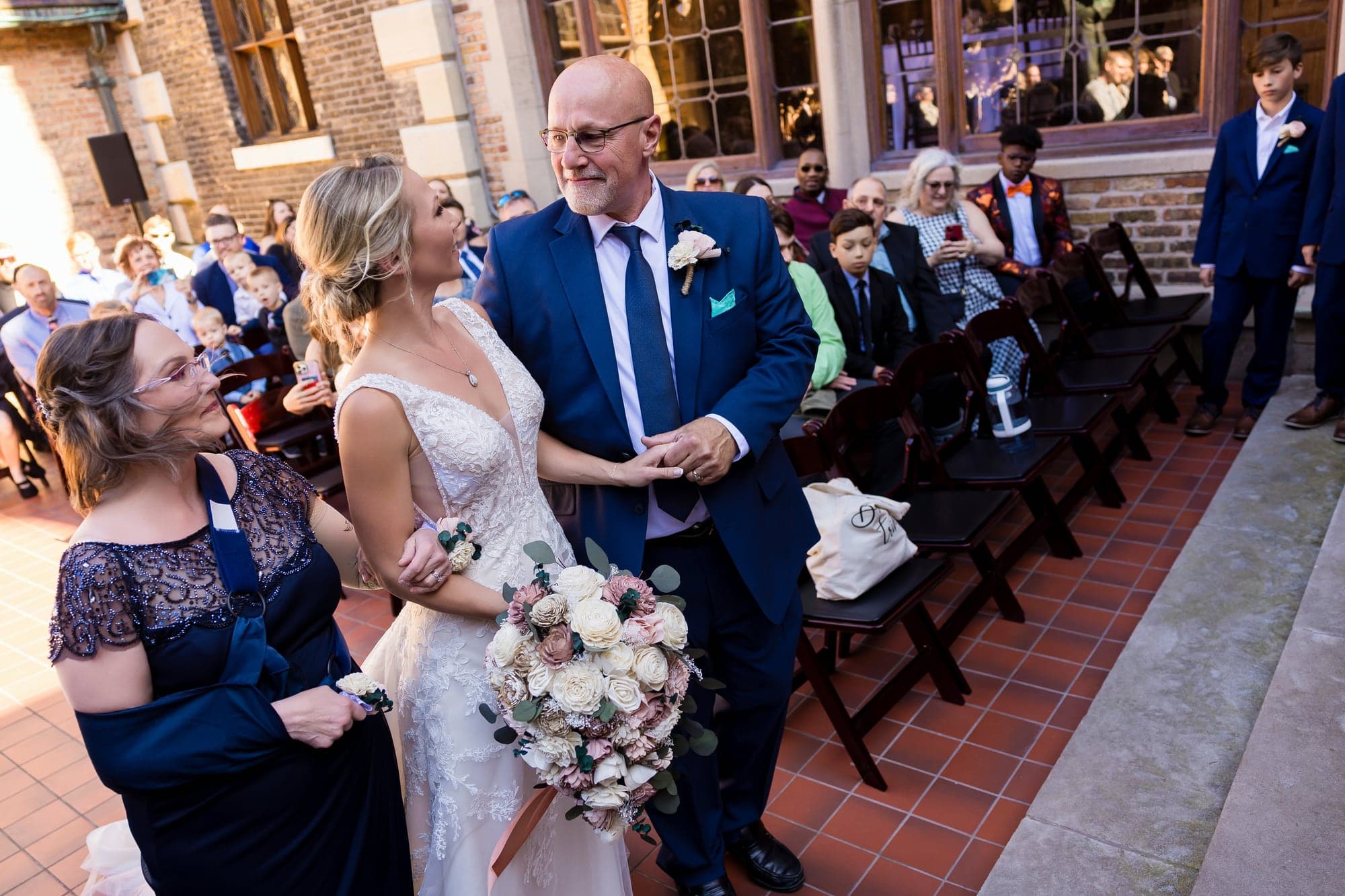 Brittany and Troy exchanging vows during their Milwaukee ceremony