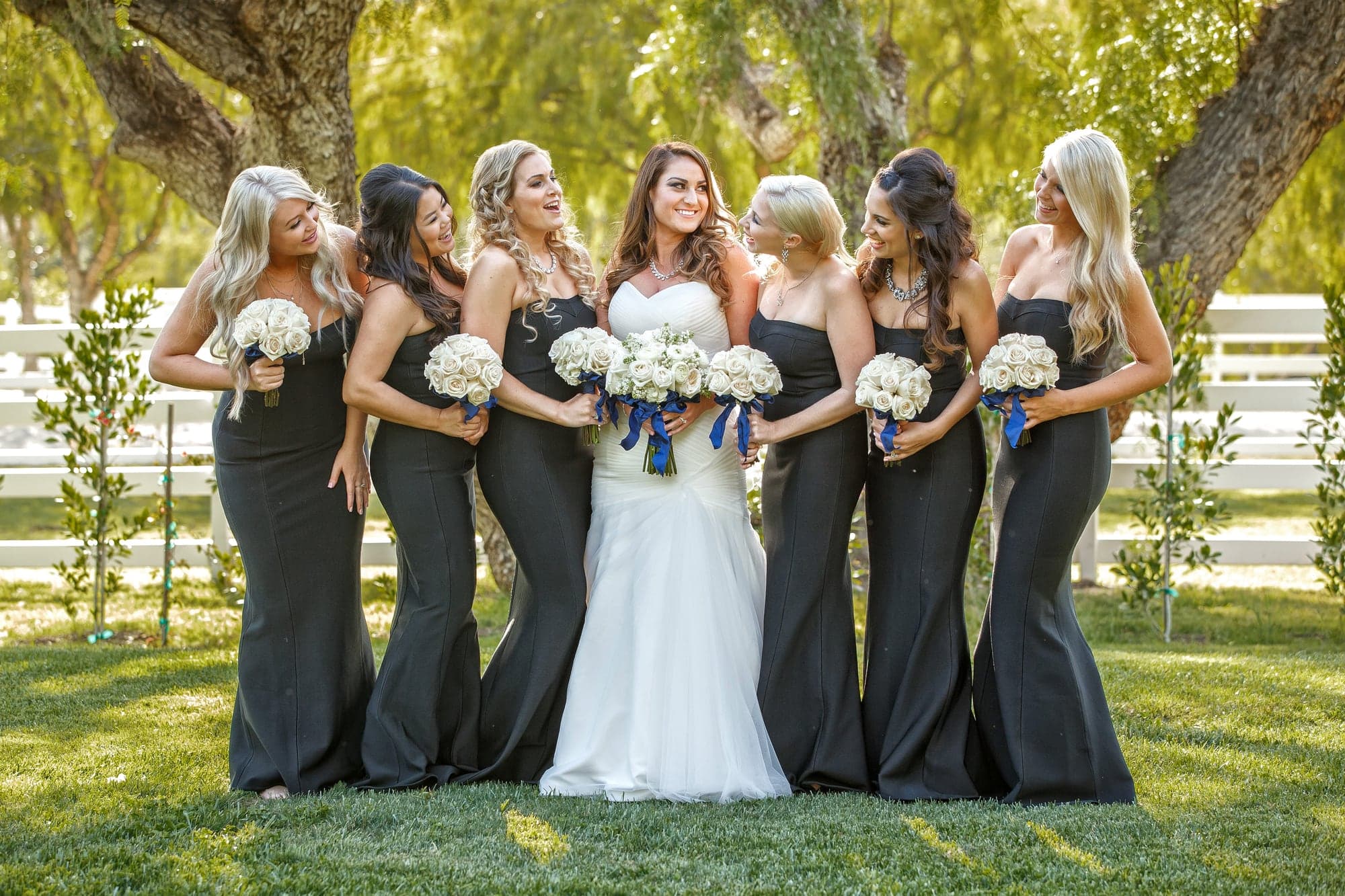 Jaqui with her wedding party beneath the trees