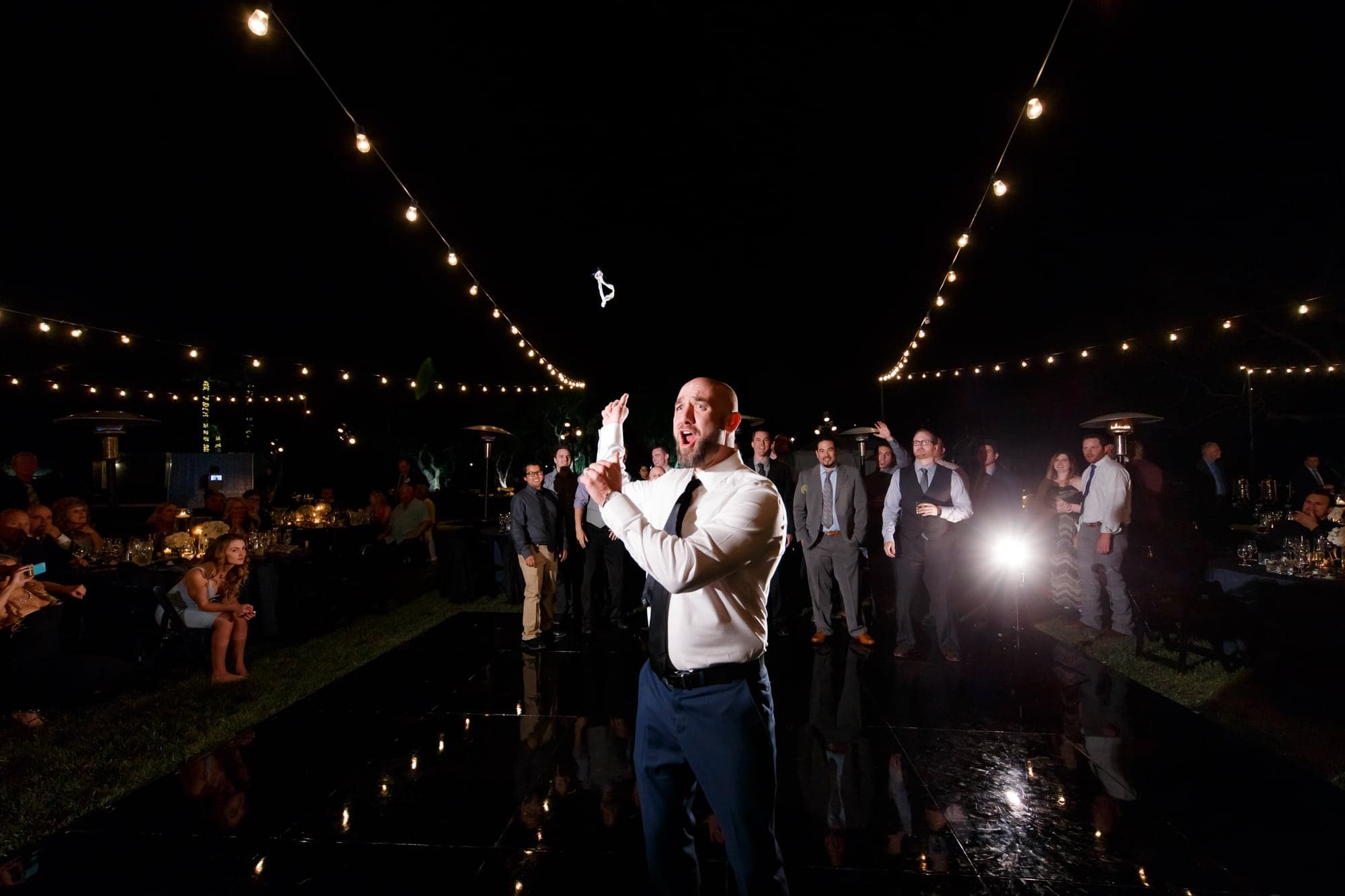Guests dancing during the outdoor reception