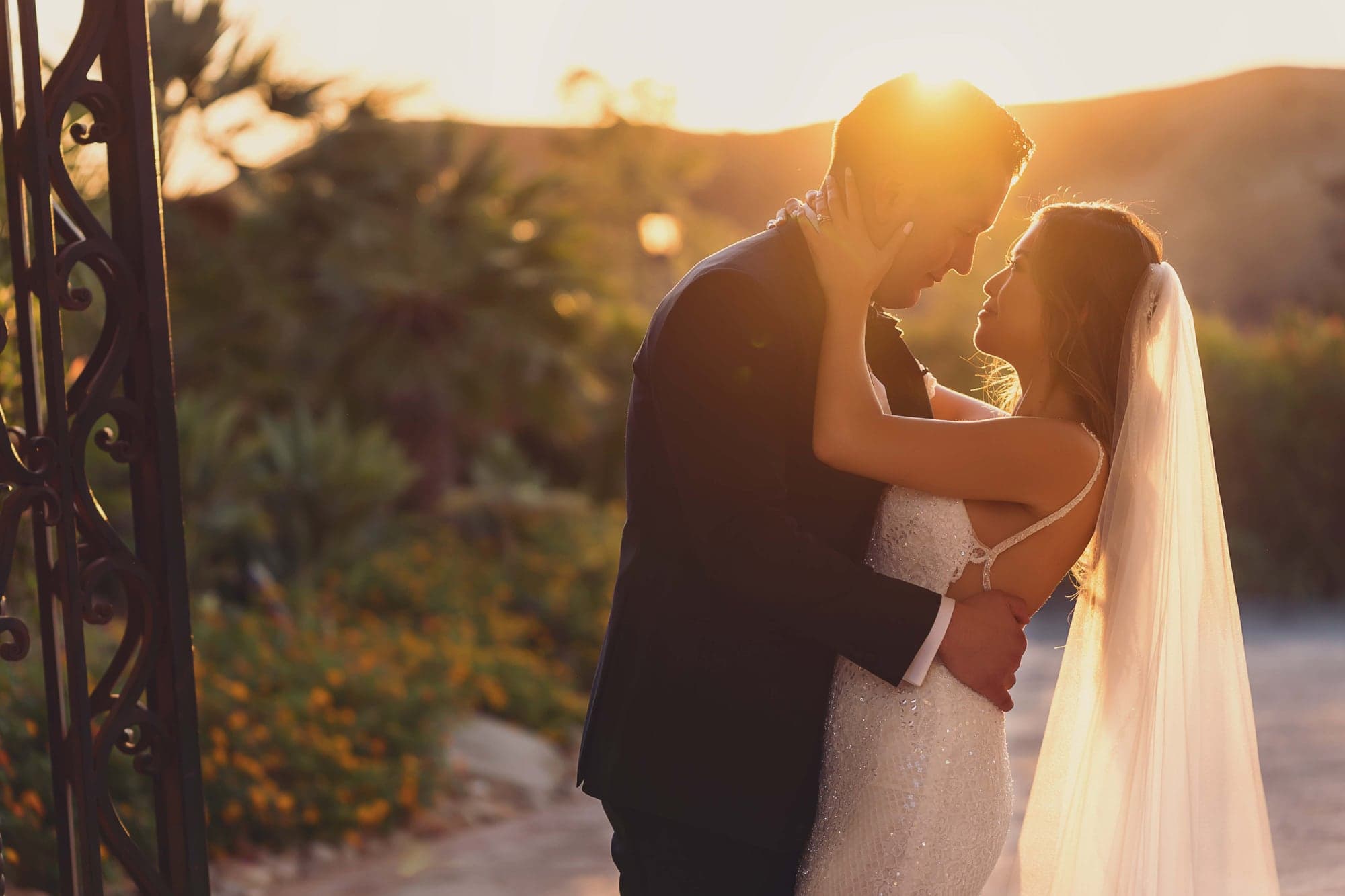 Stephanie and Lauro embracing in golden sunset light