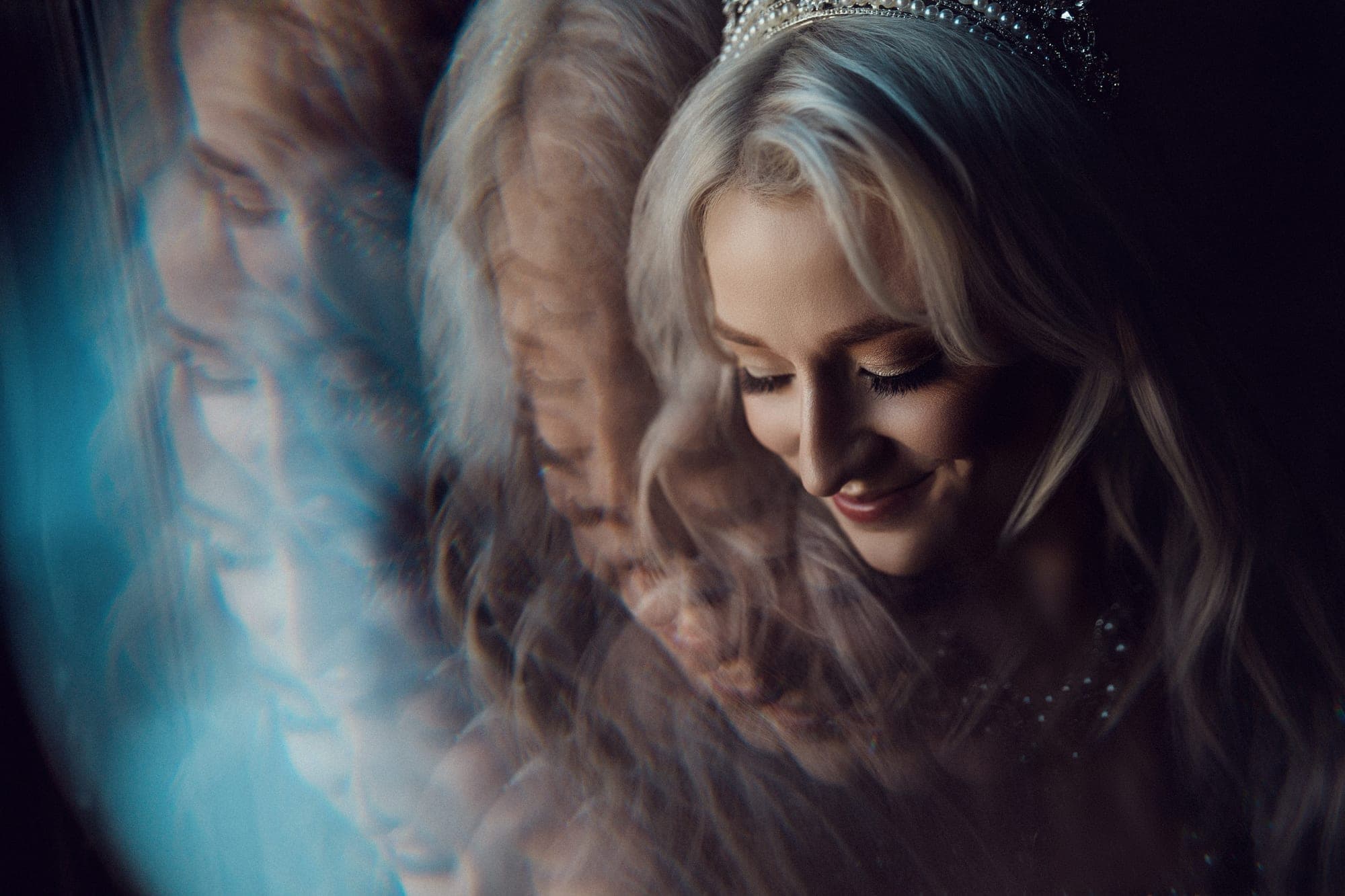 Bridal portrait of Carly with soft light through her blonde hair and a crystal headpiece