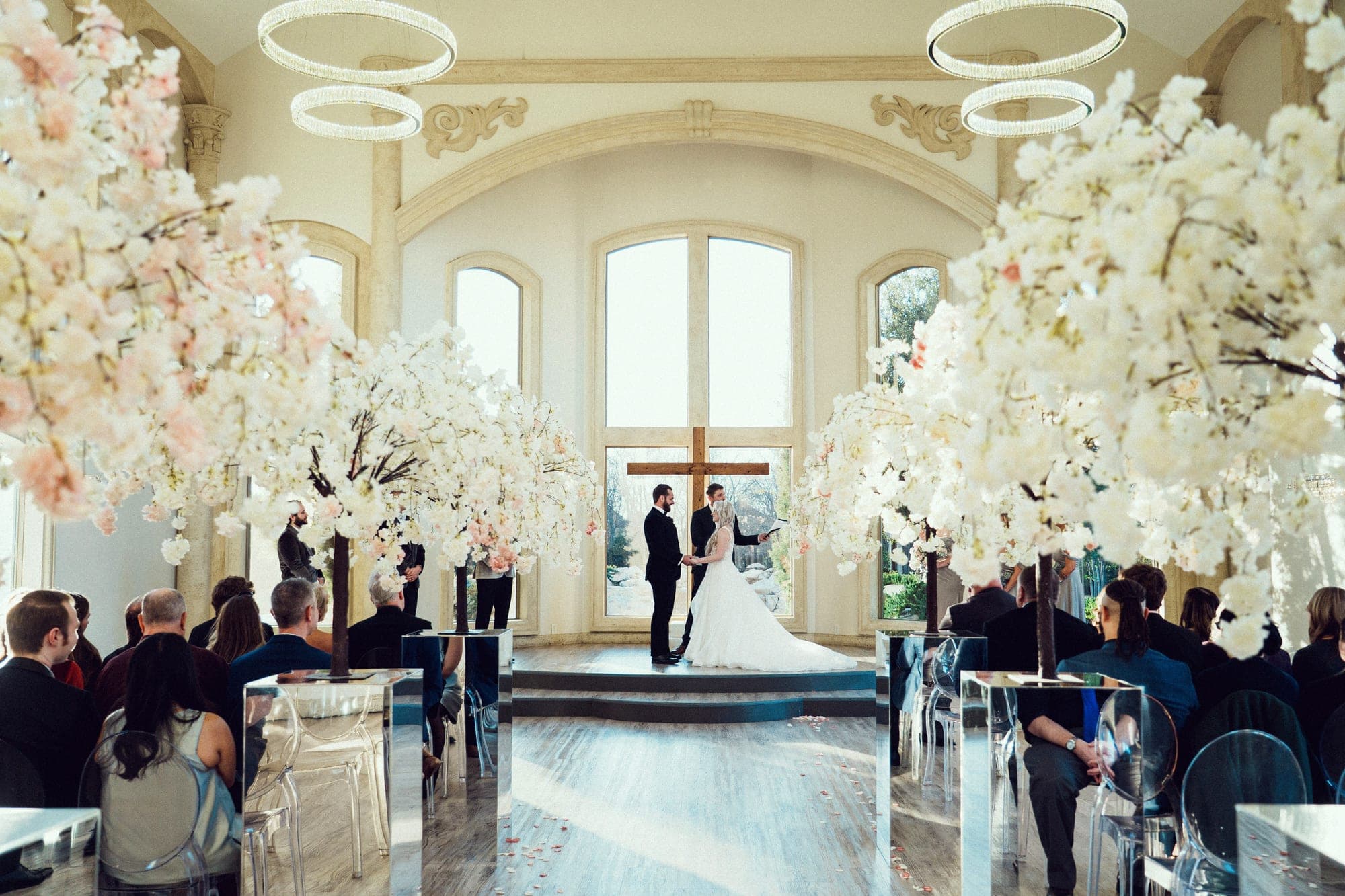 Carly entering the chapel as guests stand