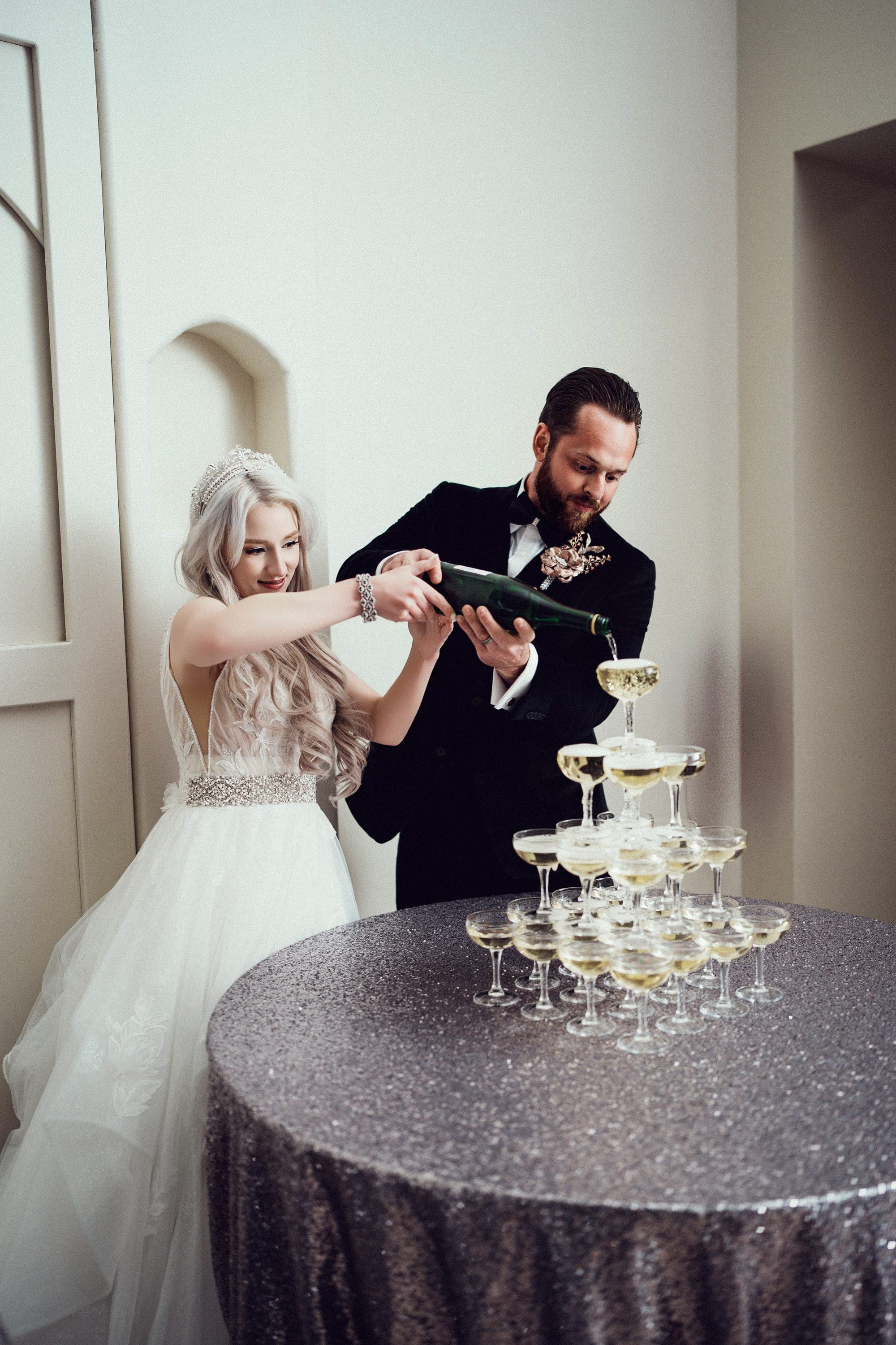 Christopher pouring the champagne tower at the reception
