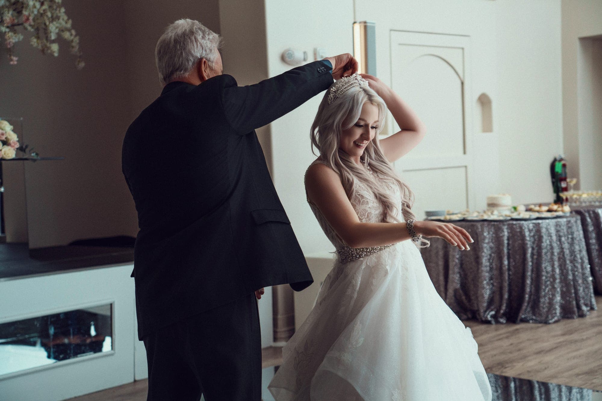 The father-daughter dance under the ballroom chandeliers