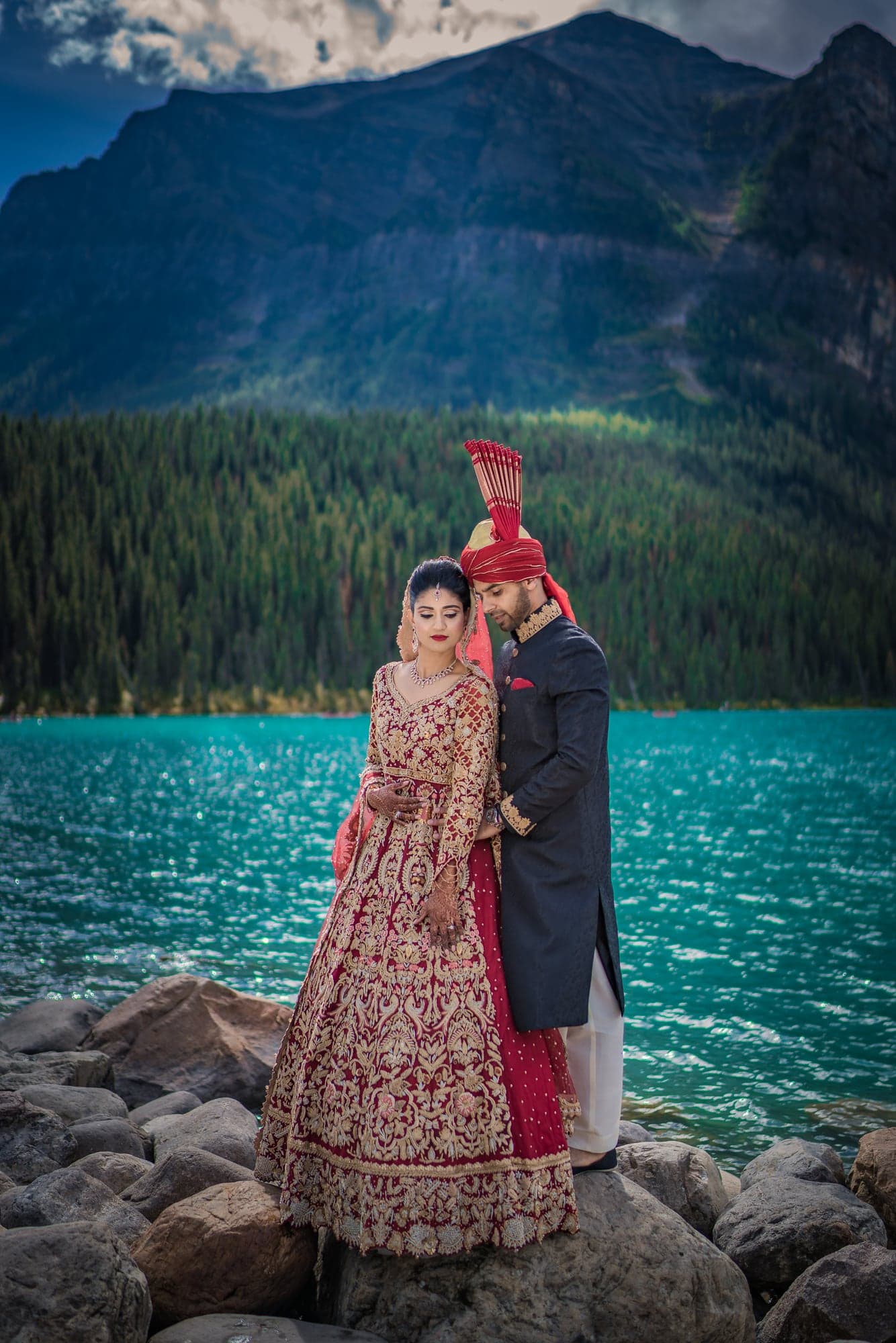 Lubna and Waqas beside turquoise Lake Louise