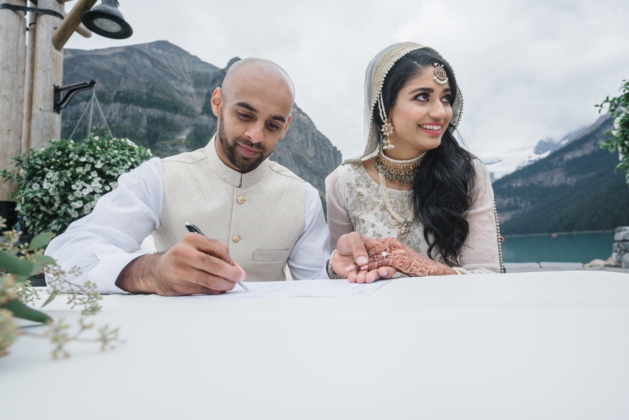 Lubna and Waqas signing their wedding documents
