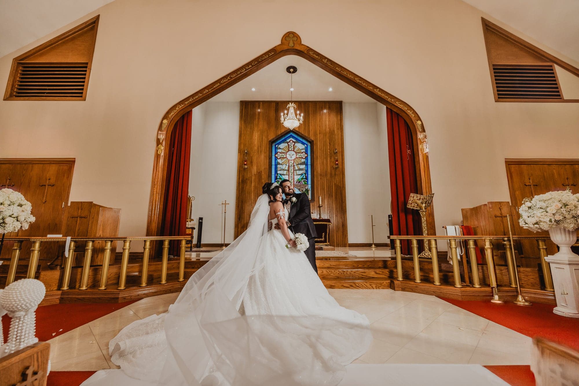 Amanda seated beneath the cathedral altar after the ceremony