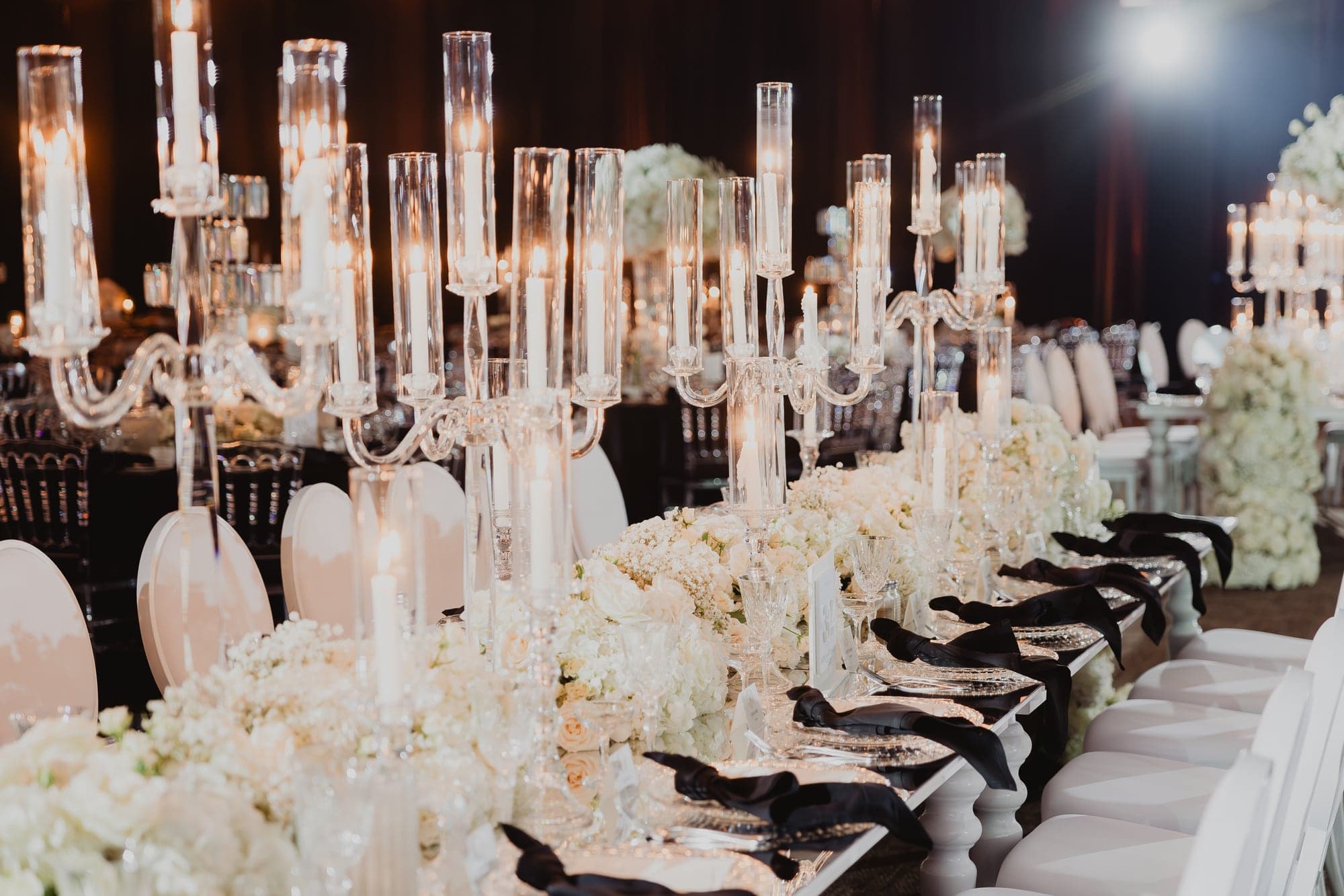 White floral tablescape and crystal candles at Larsa Banquet Hall