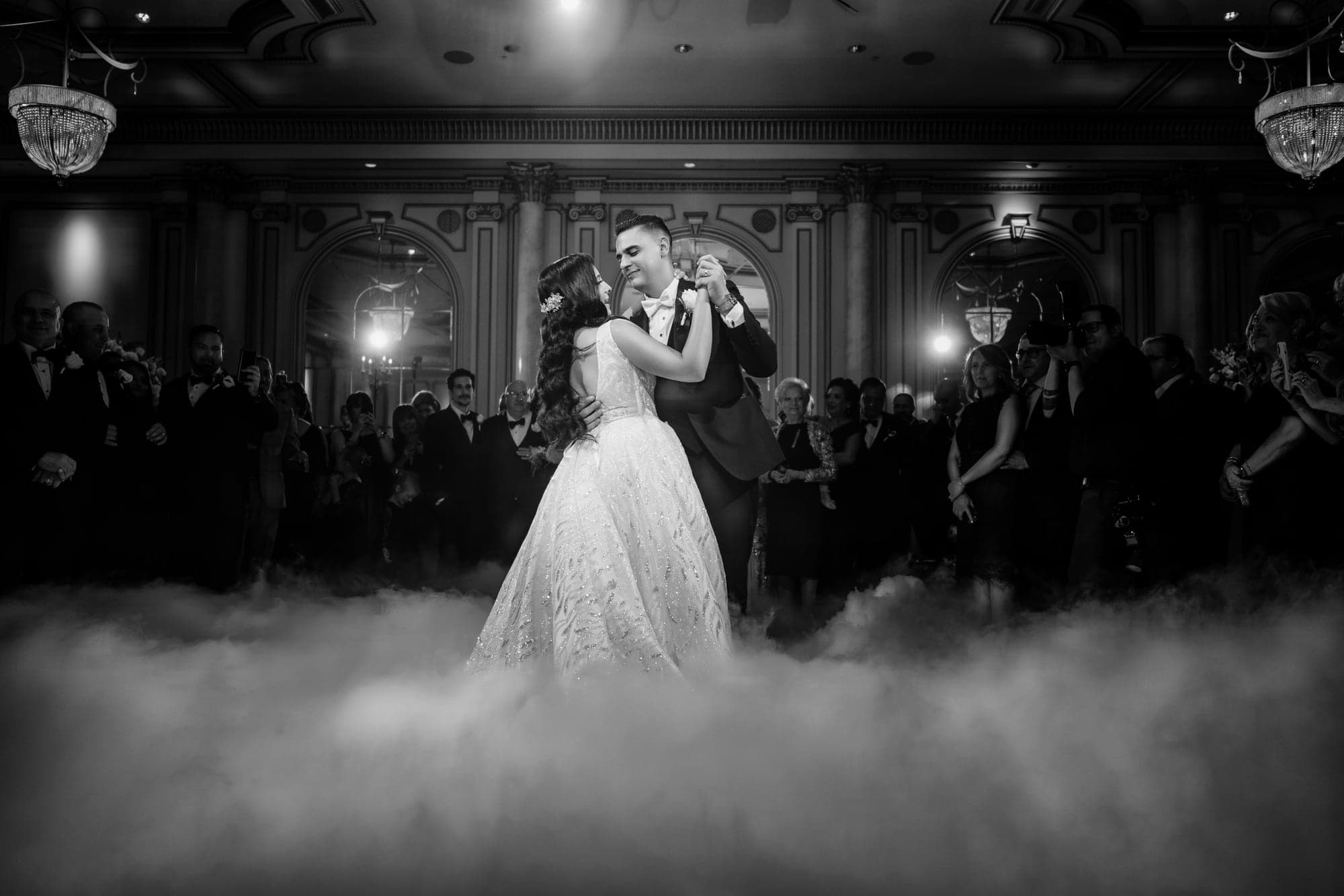 Piera crossing the Legacy Castle dance floor through low clouds during the reception