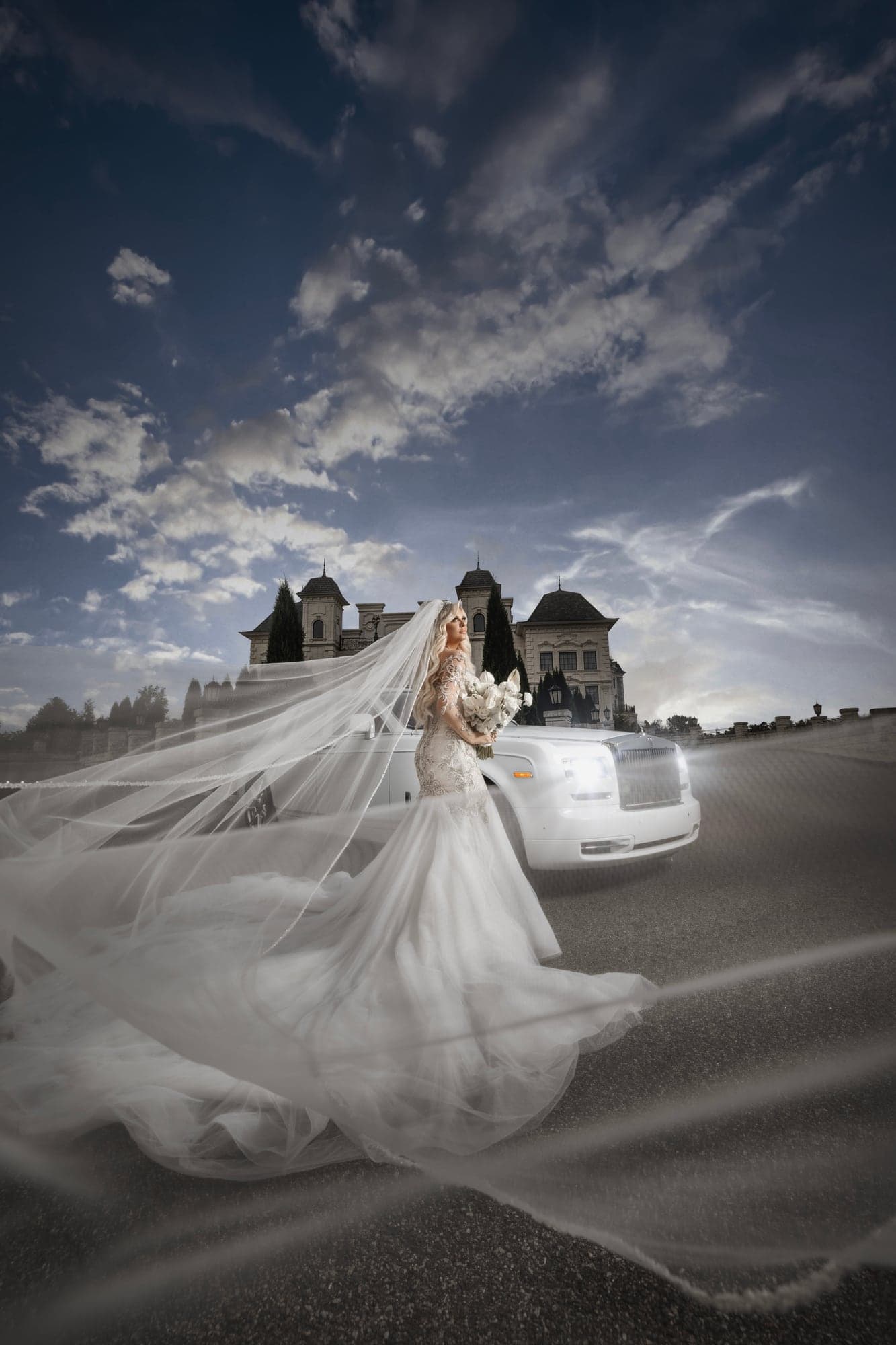 Kaitelyn and Blaise outside The Legacy Castle beneath a dramatic sky