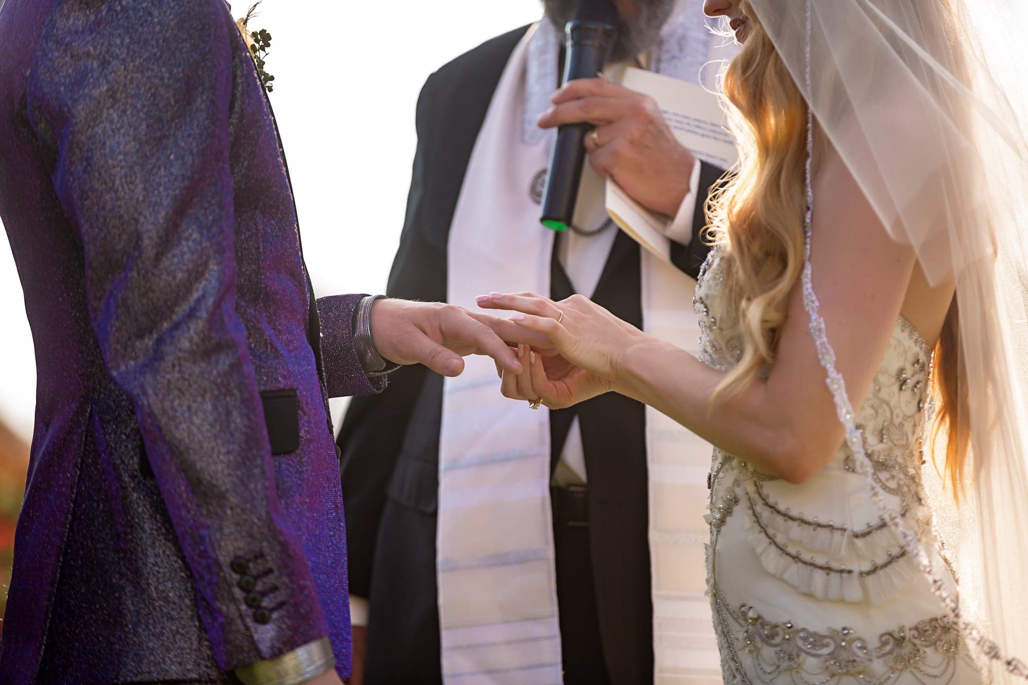Jamie and Ramage exchanging rings during their garden ceremony