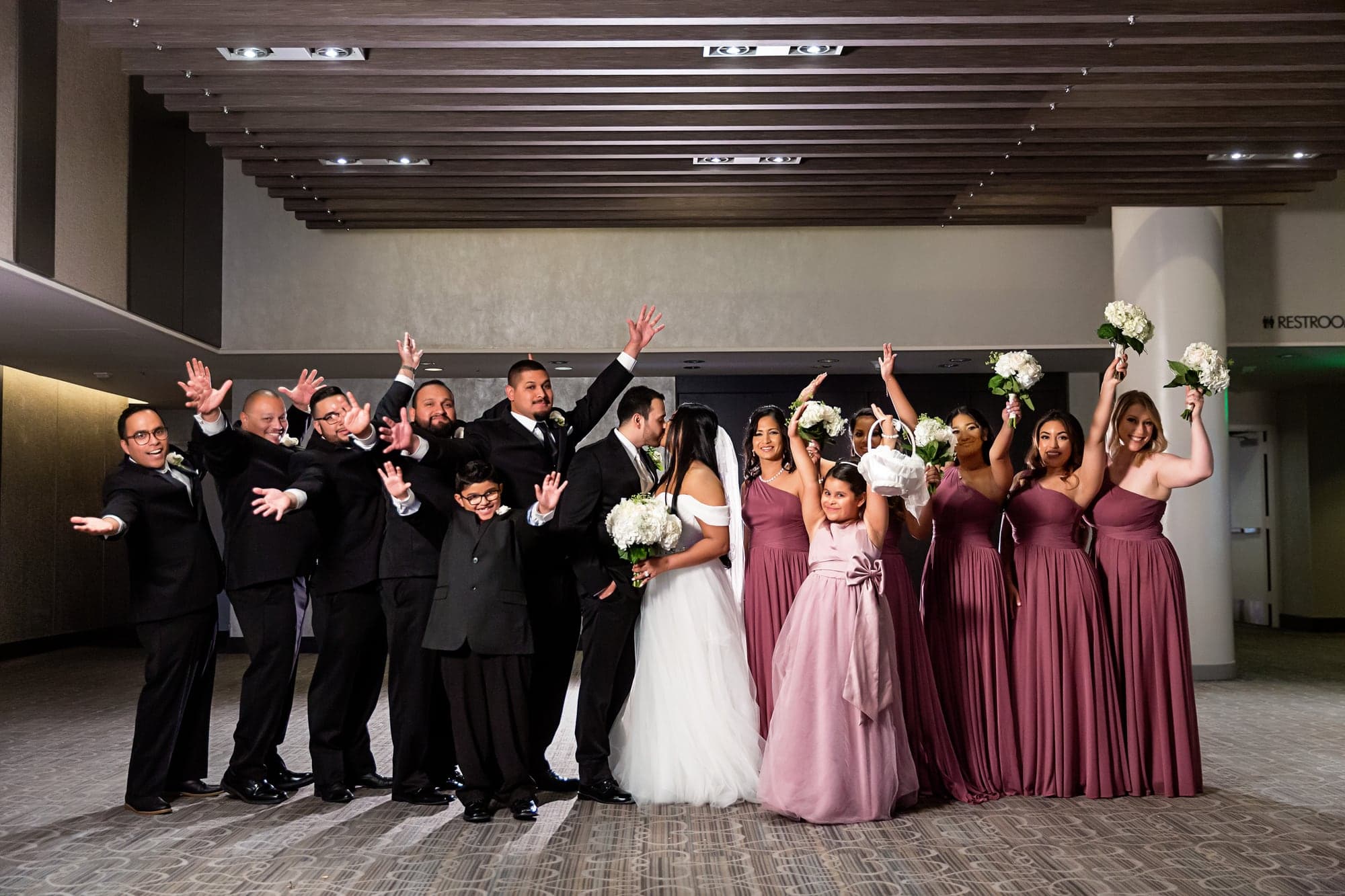 Tari and JJ celebrating with their wedding party