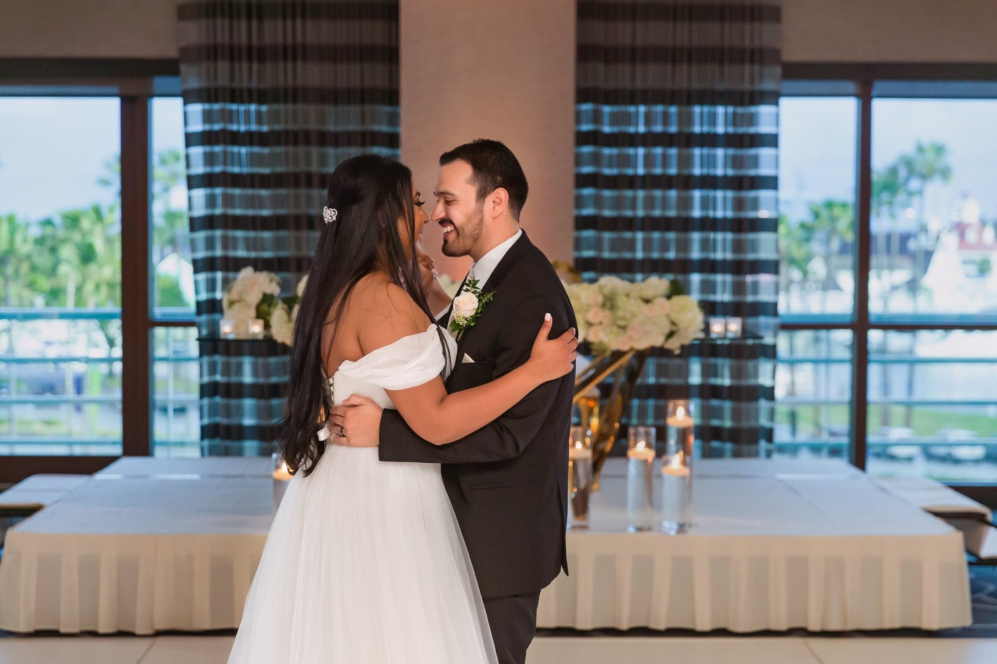 Tari and JJ sharing their first dance in the ballroom