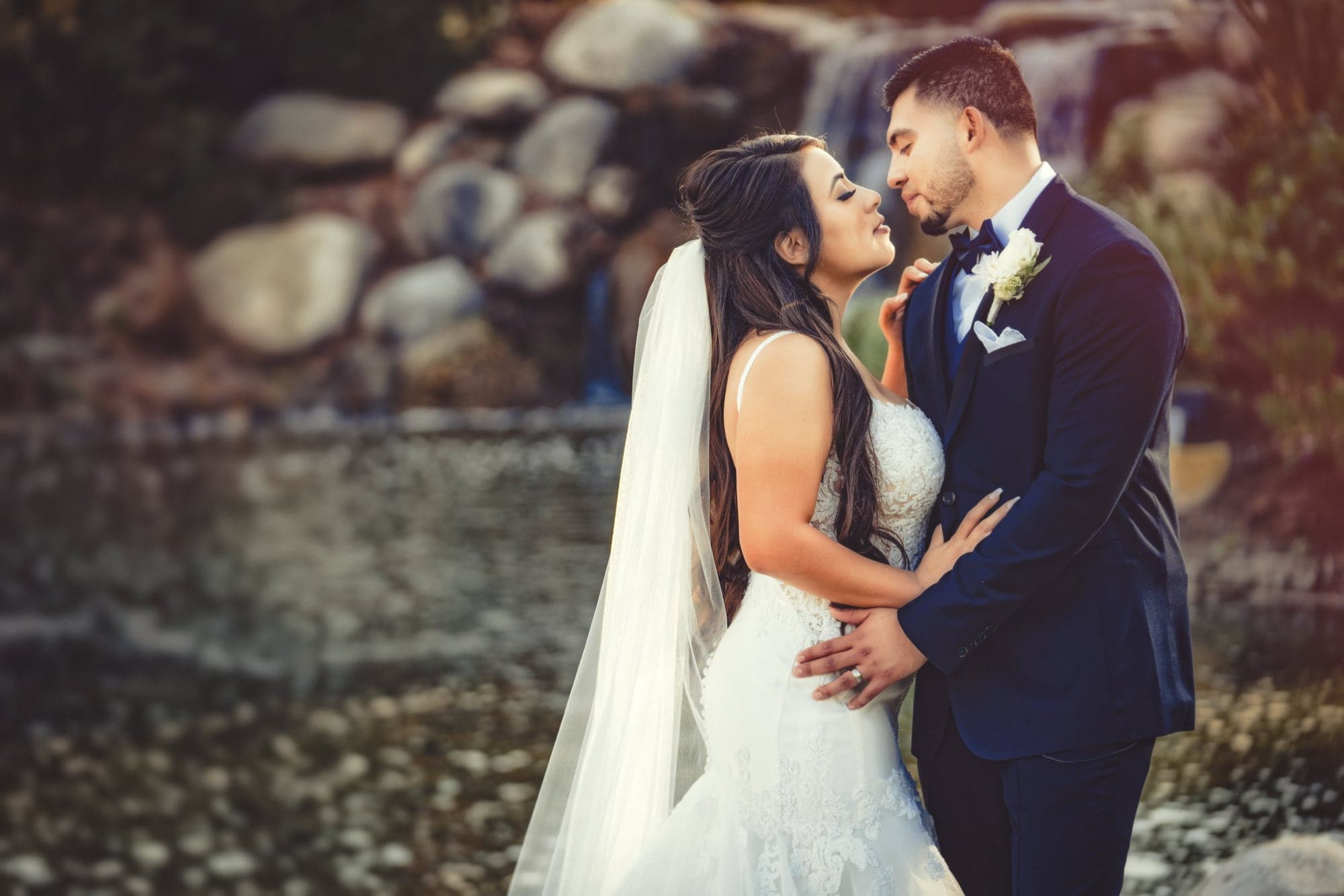 Cathedral veil flowing across a Los Coyotes wedding portrait