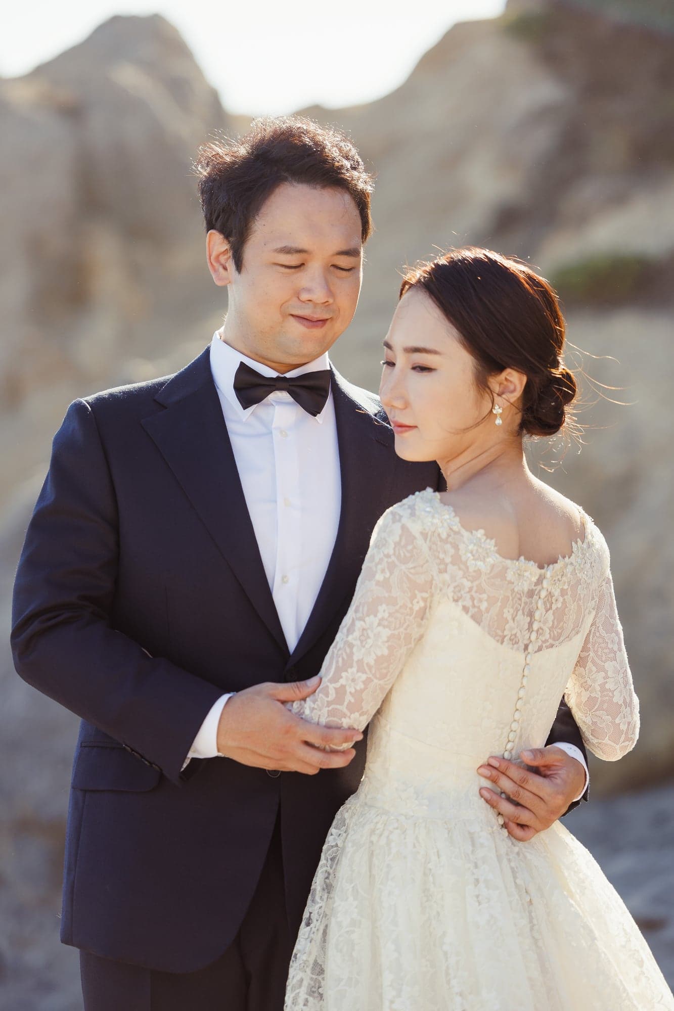 Close portrait of Lauren and Lee in soft coastal light
