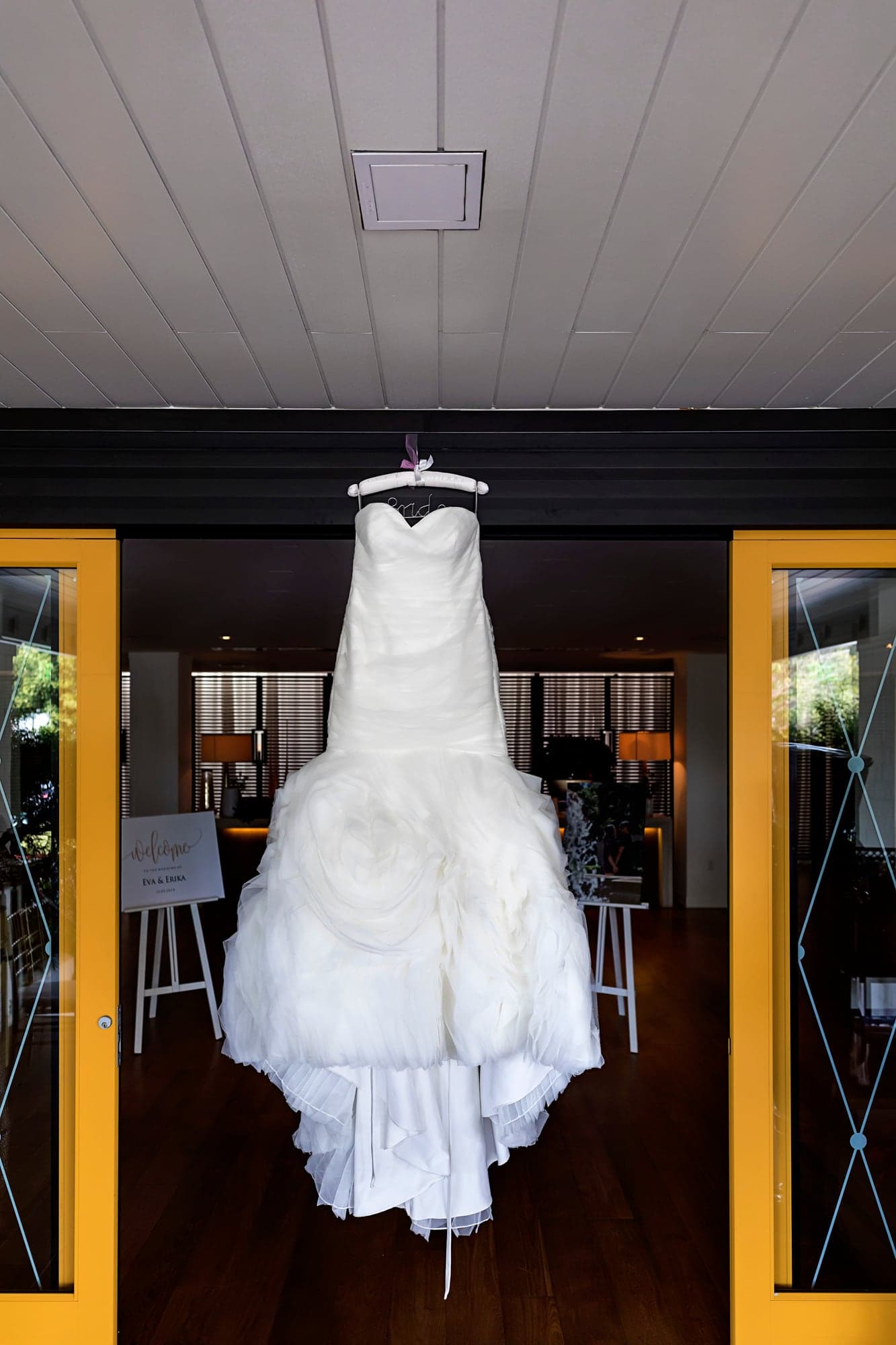 Wedding dress hanging before the Manhattan Country Club ceremony
