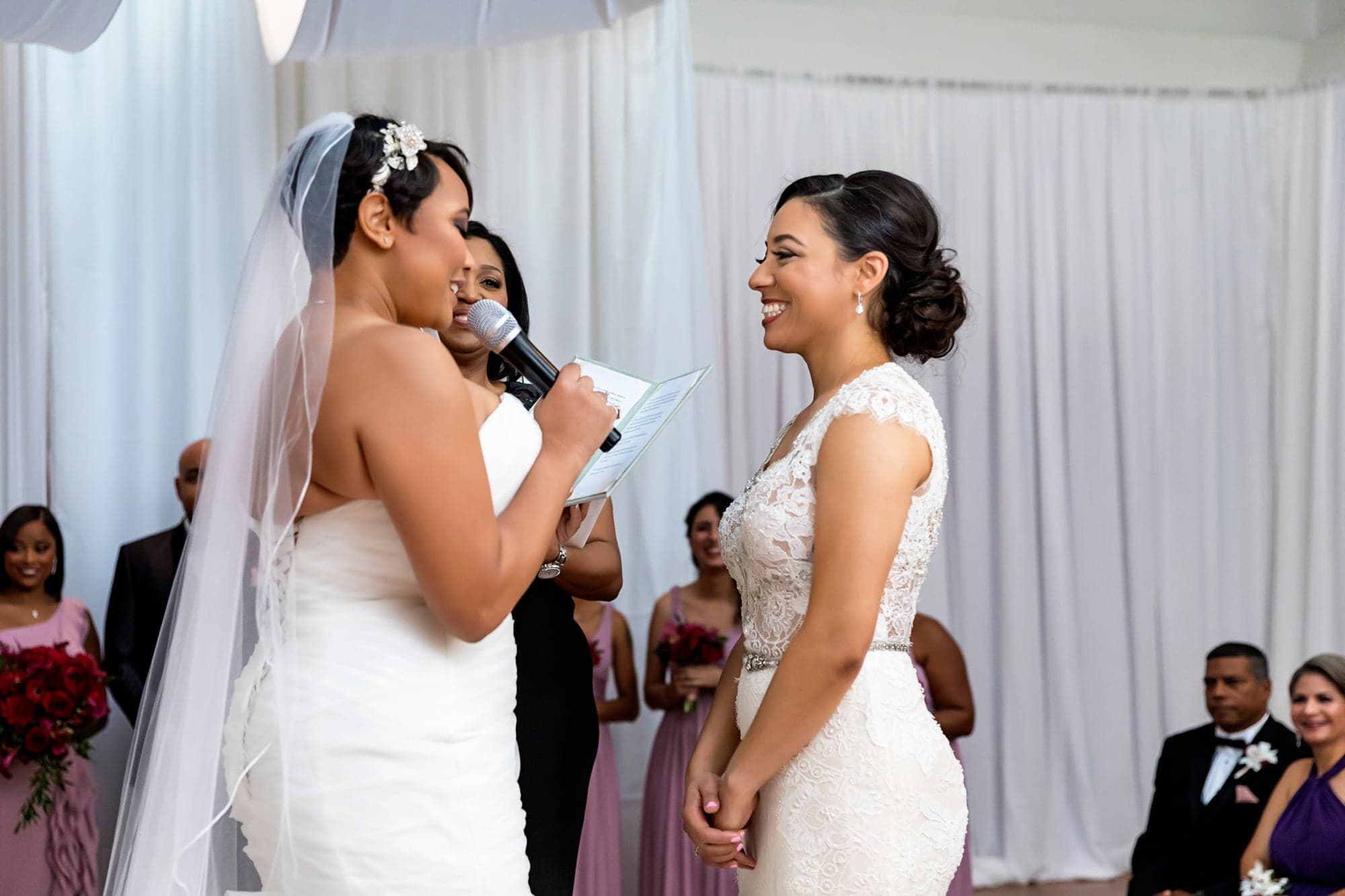 Two brides exchanging vows during their ceremony