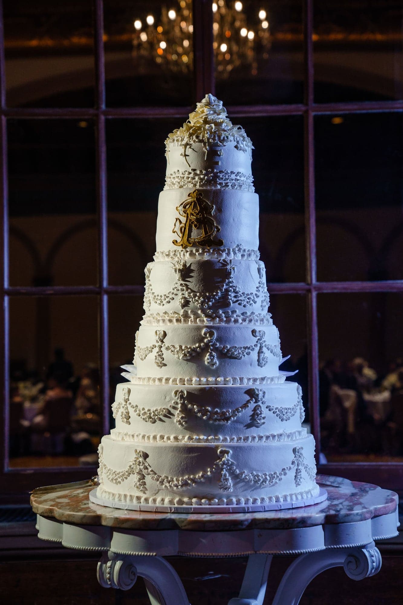 Samantha and Andrew beside their wedding cake