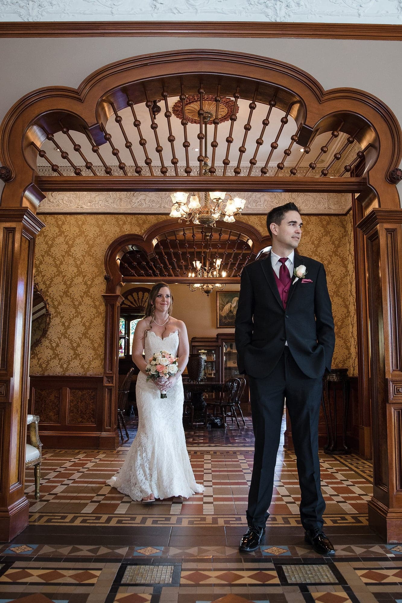 Chelsea and Greg photographed in the Newhall Mansion foyer