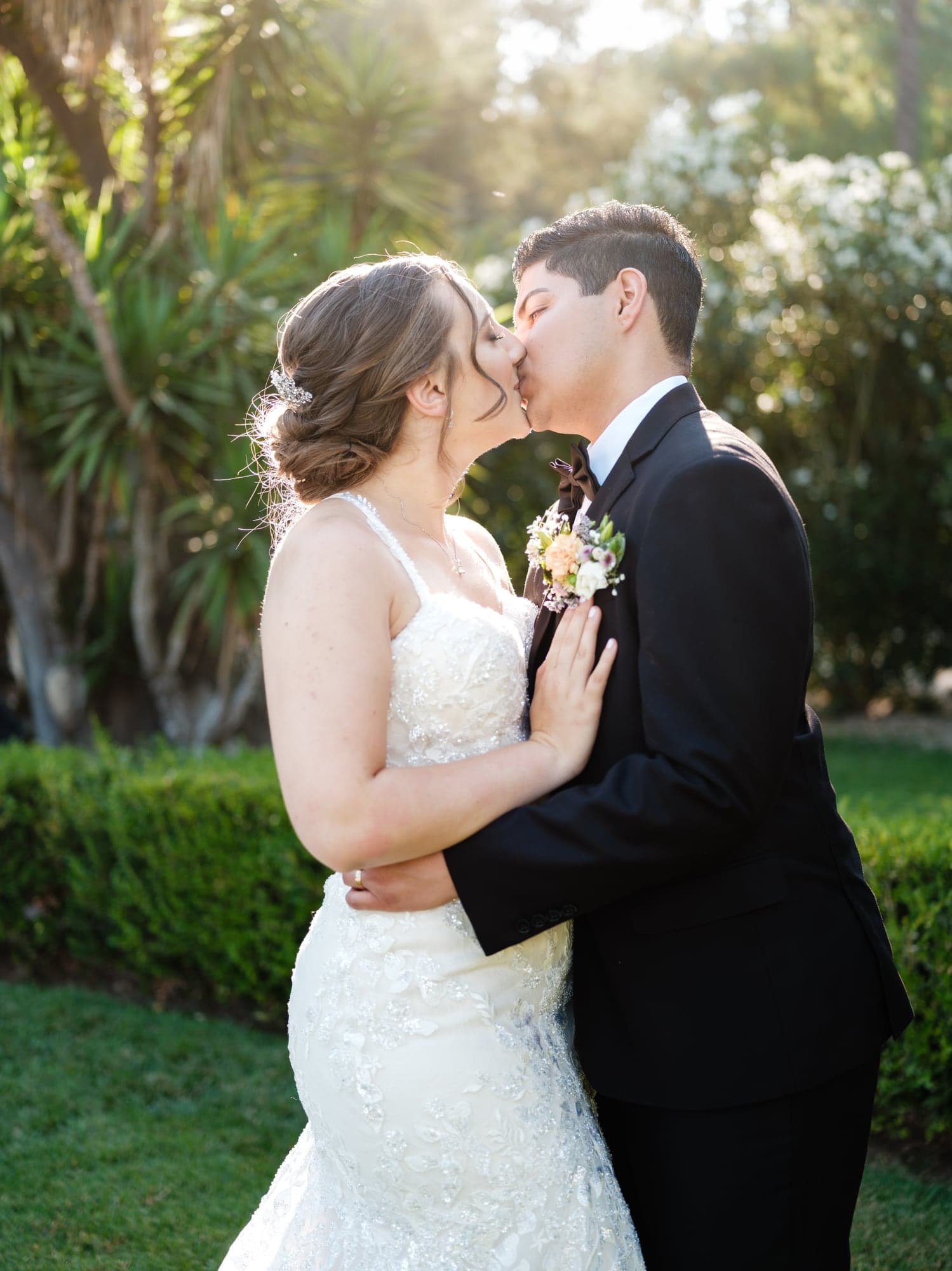 Haley and Clayton embracing in the garden after their ceremony