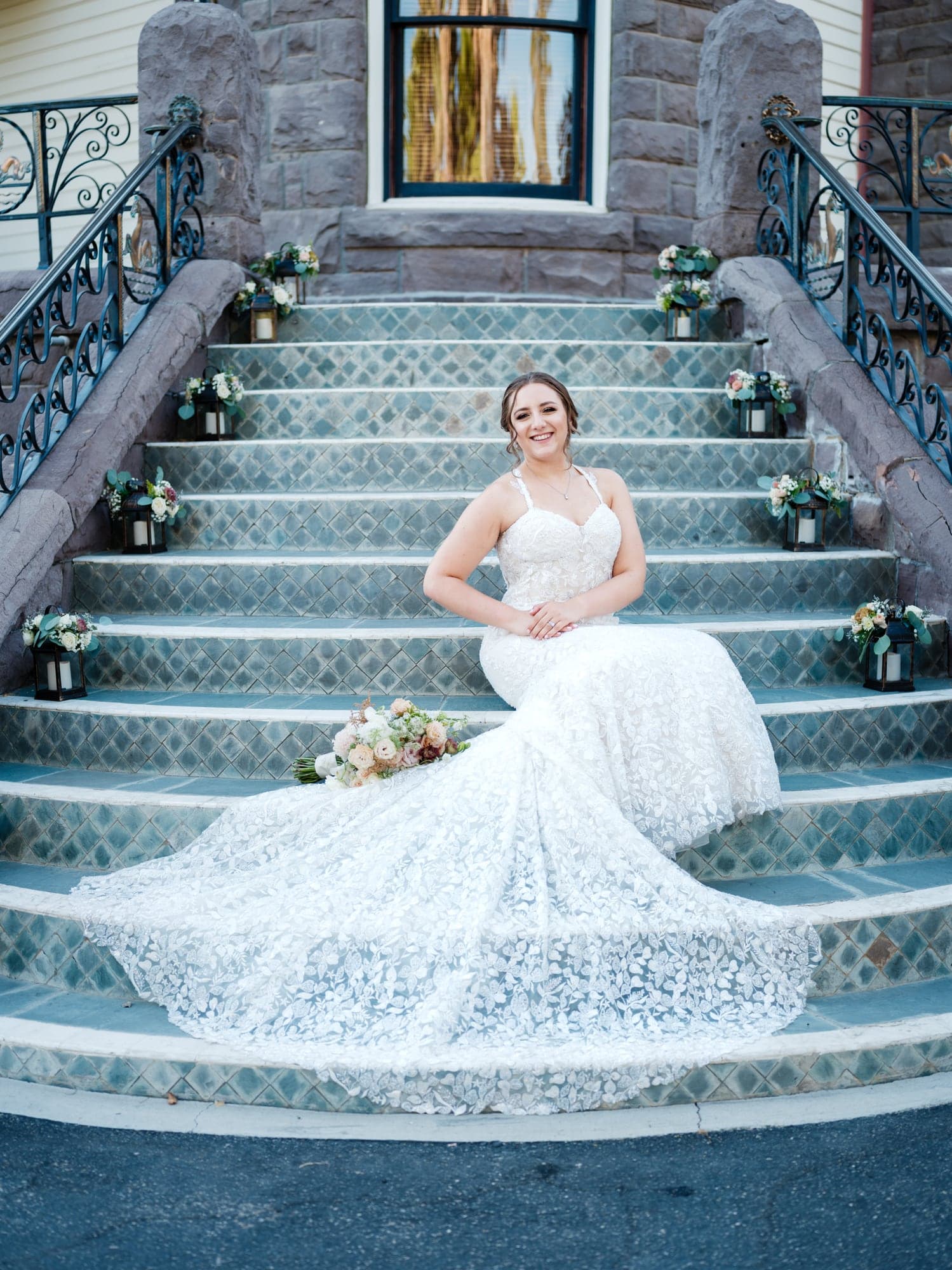 Haley seated on the tiled staircase in her wedding gown