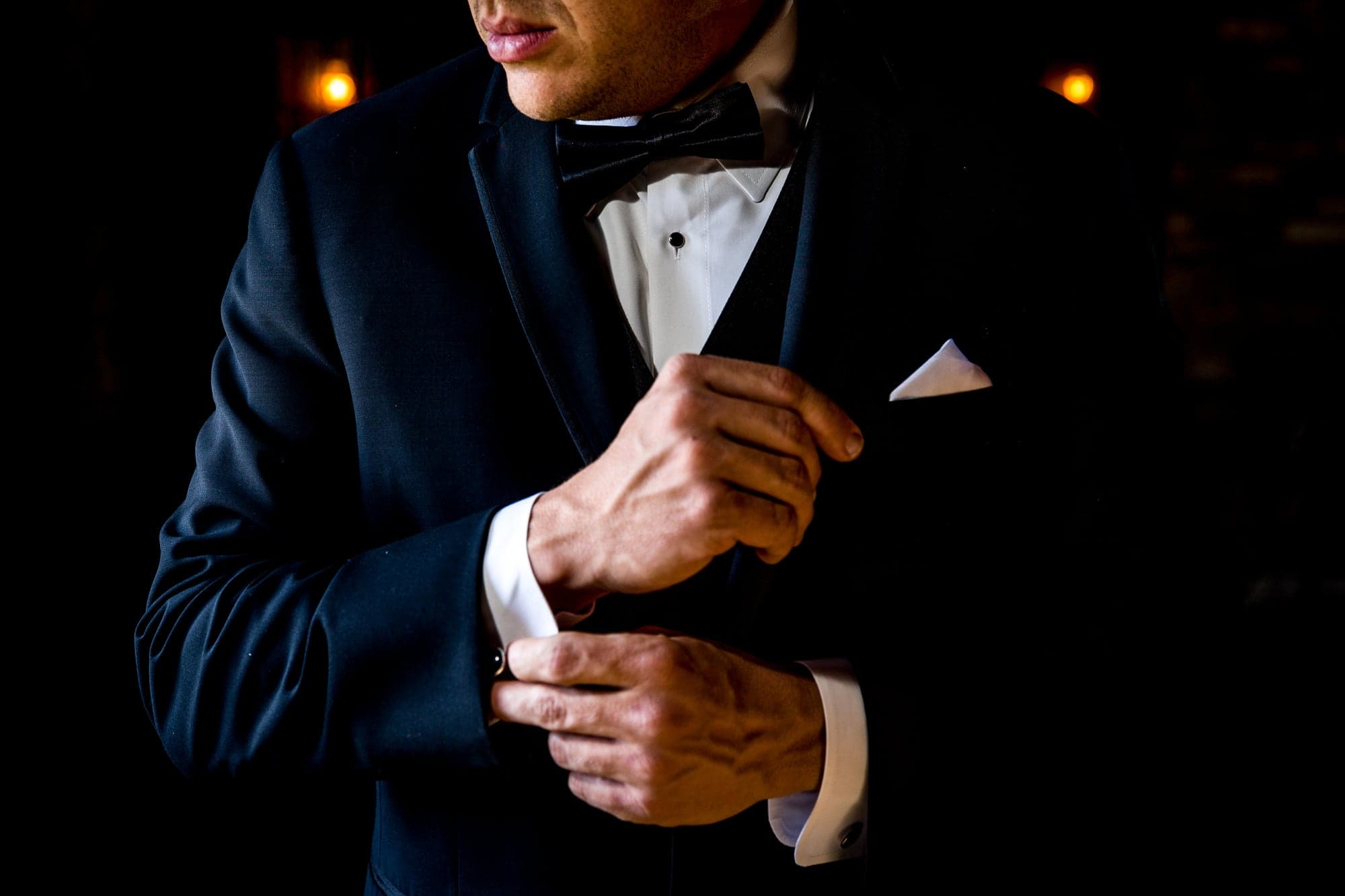 Josh adjusting his tuxedo before the Newhall Mansion wedding