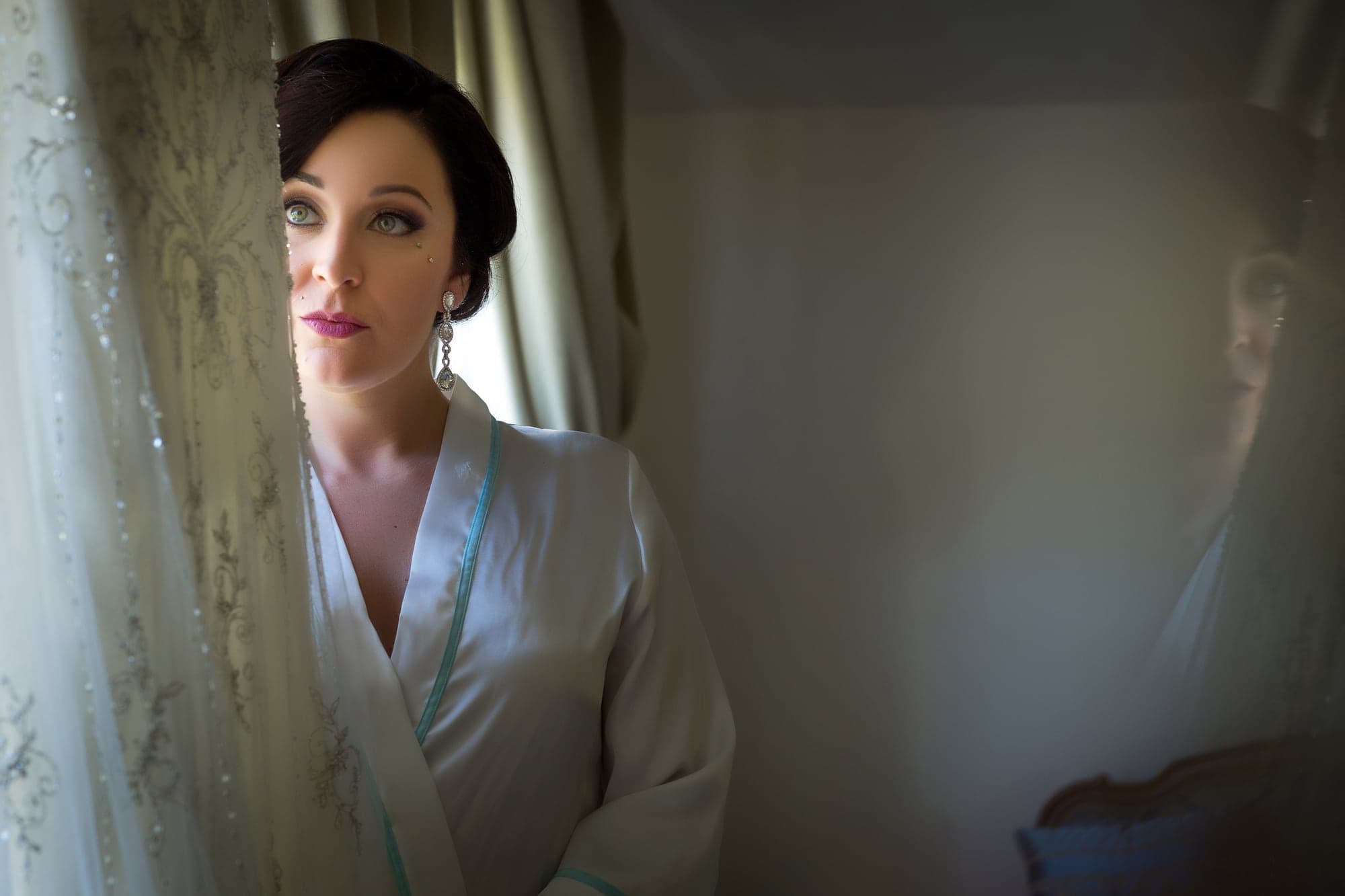 Tiffany preparing beside a window at Newhall Mansion