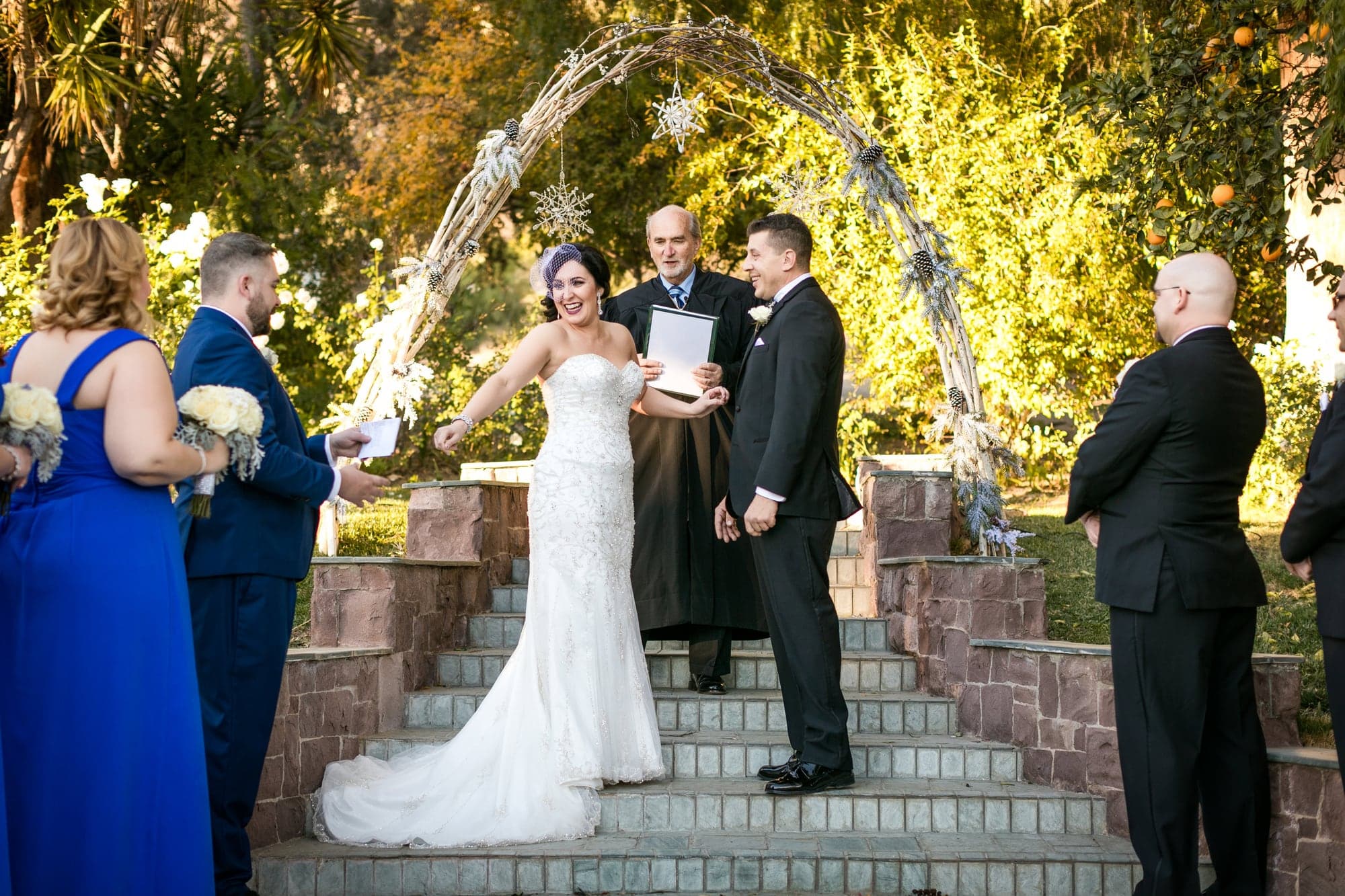 Tiffany and Josh exchanging vows in the Newhall Mansion garden