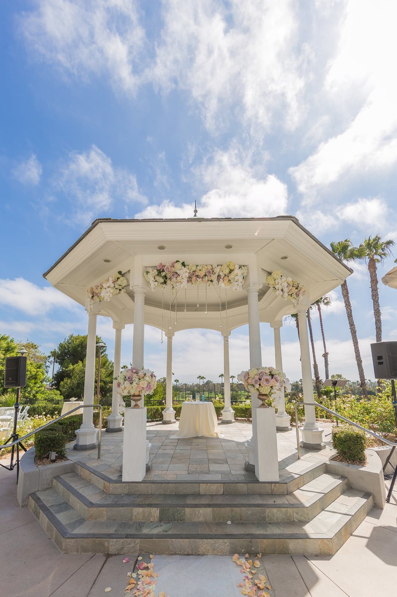 Alan and his groomsmen beside the outdoor gazebo