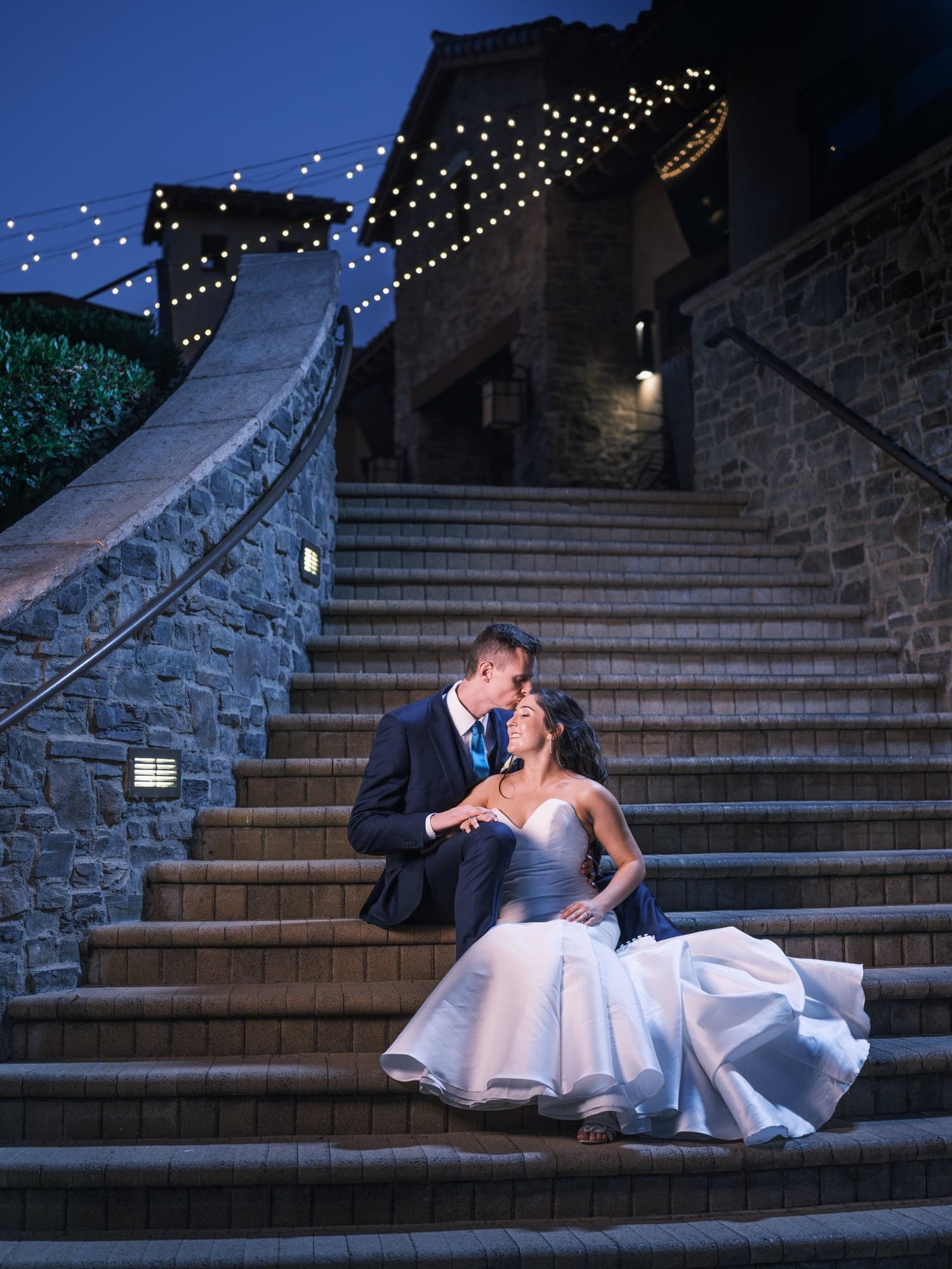 Katherine and Andrew on the stone stairs at night
