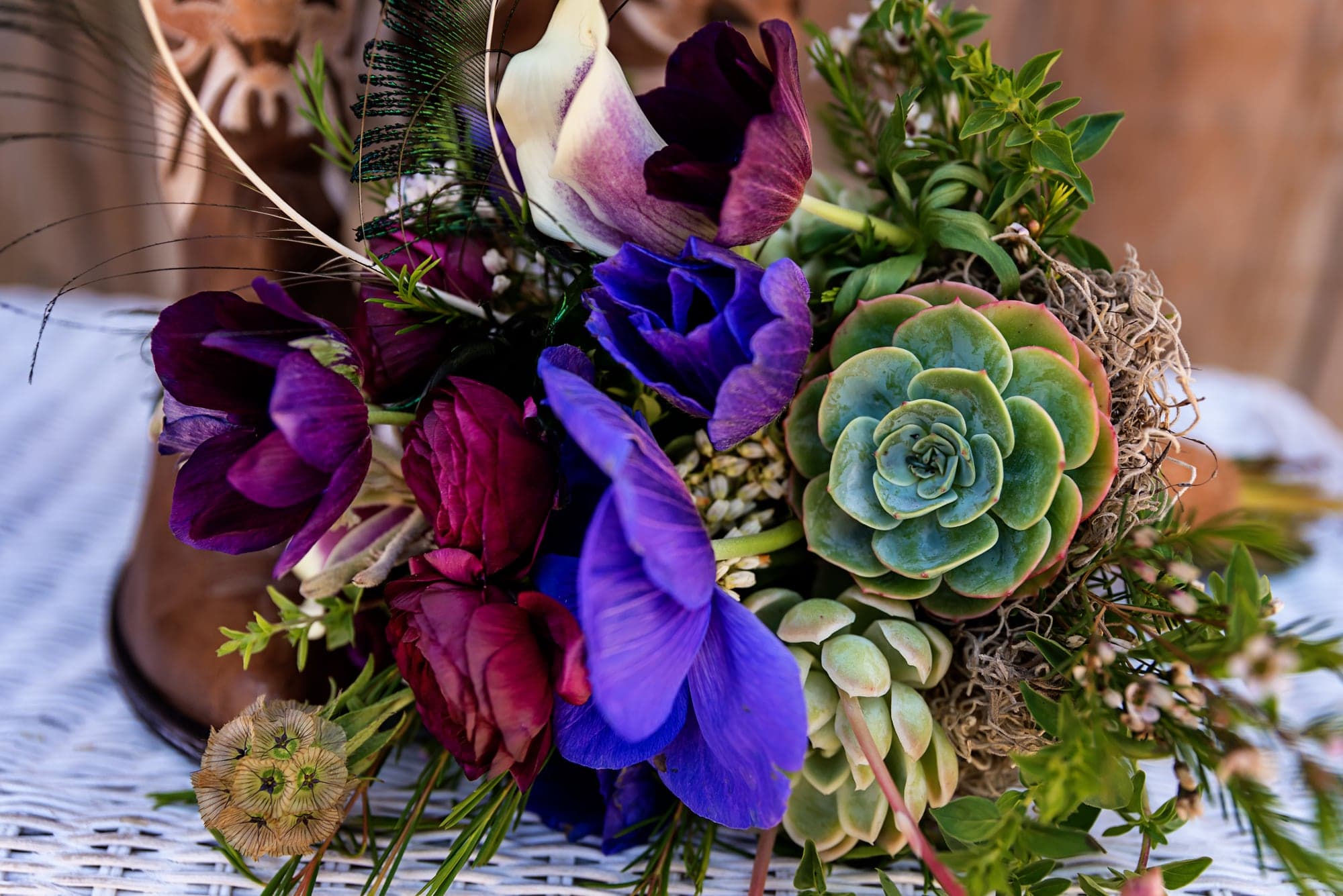 Brenda's purple succulent bouquet with the wedding rings
