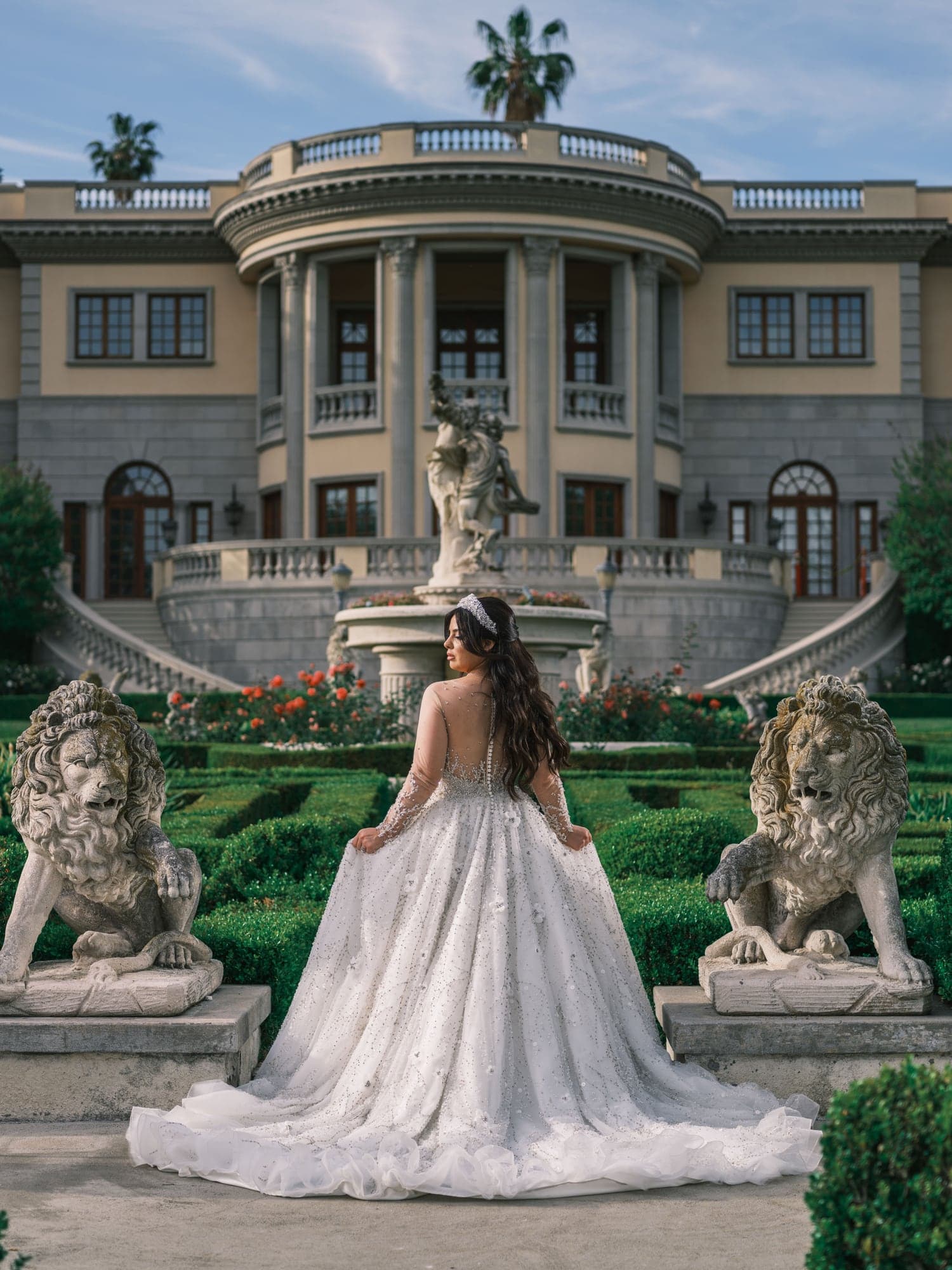 Michelle and Demiel walking through the formal gardens