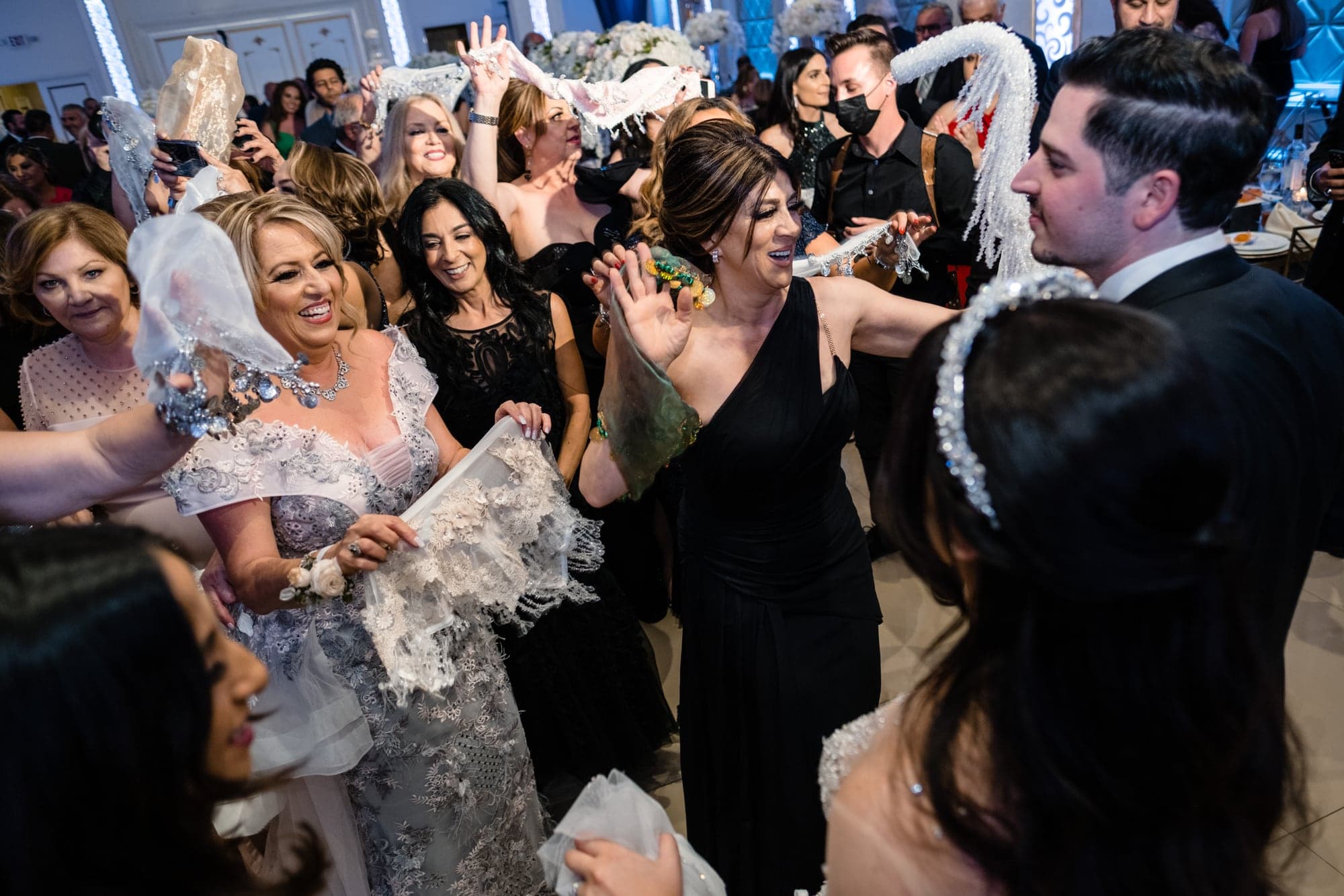 Guests celebrating around Michelle and Demiel