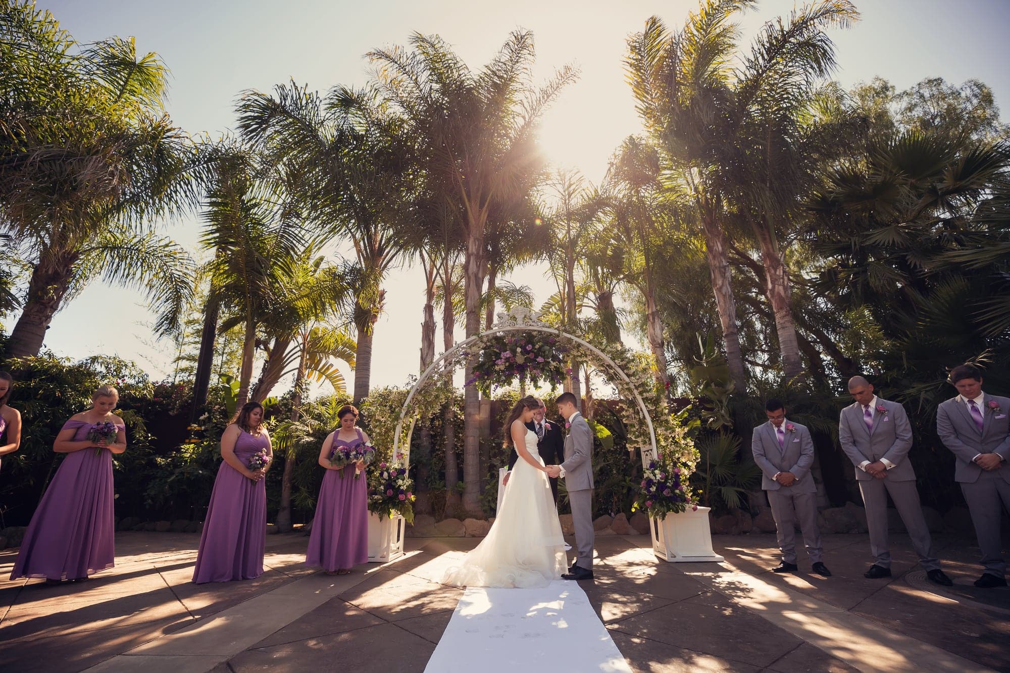 Mary walking down the garden aisle toward Cole