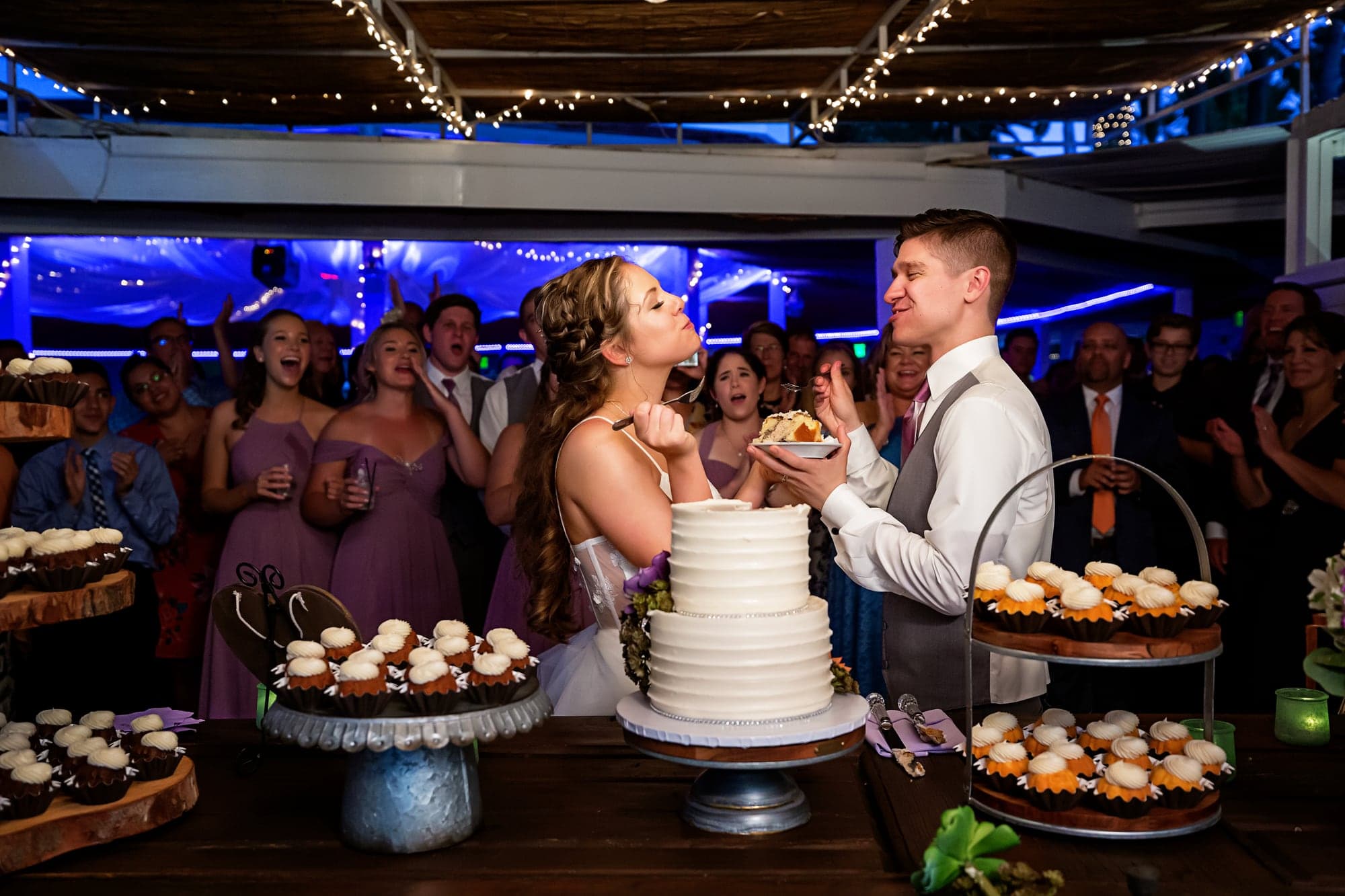 Mary and Cole cutting their wedding cake