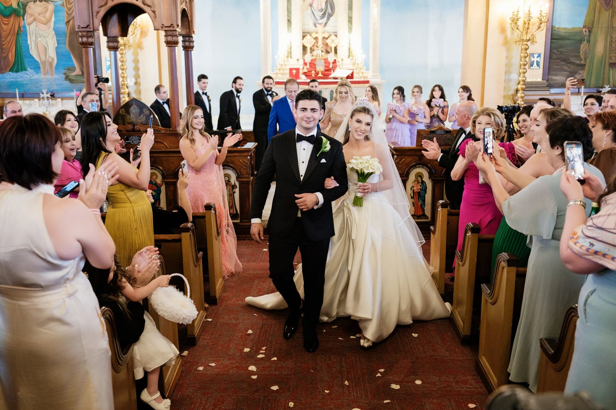 Angelina walking down the church aisle during the ceremony