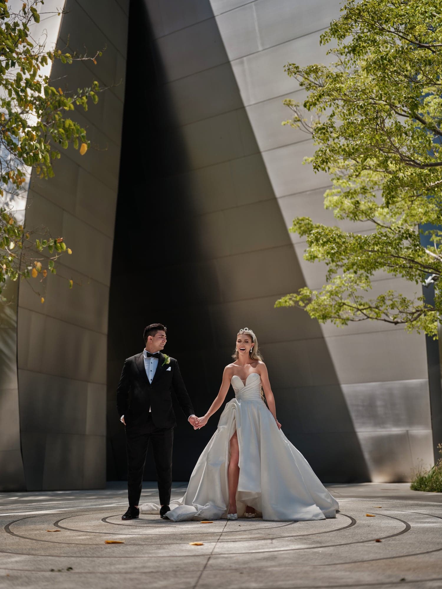 Angelina and Gevork beneath the architecture of Walt Disney Concert Hall