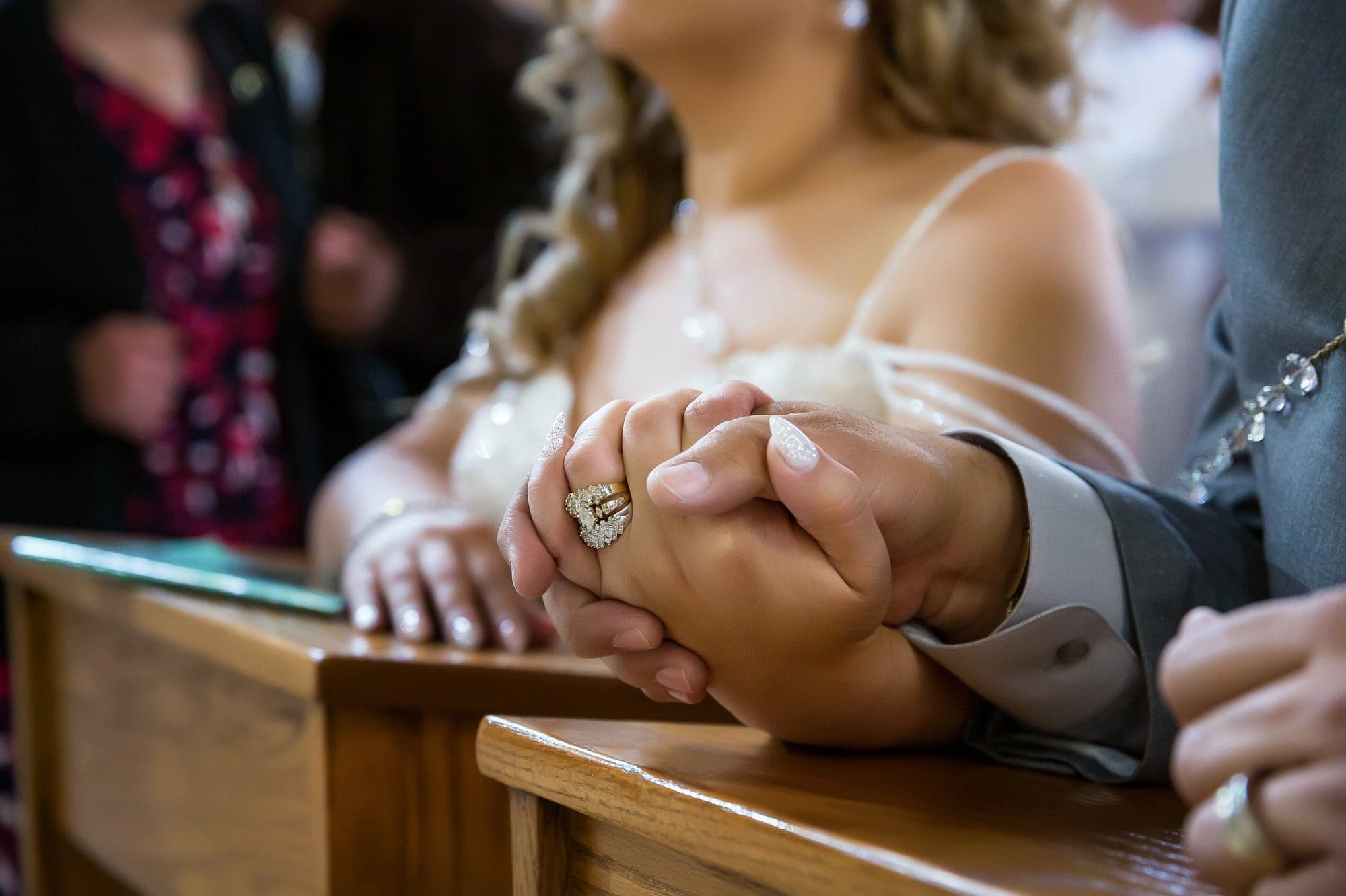 Francisco and Alejandra holding hands during the ceremony