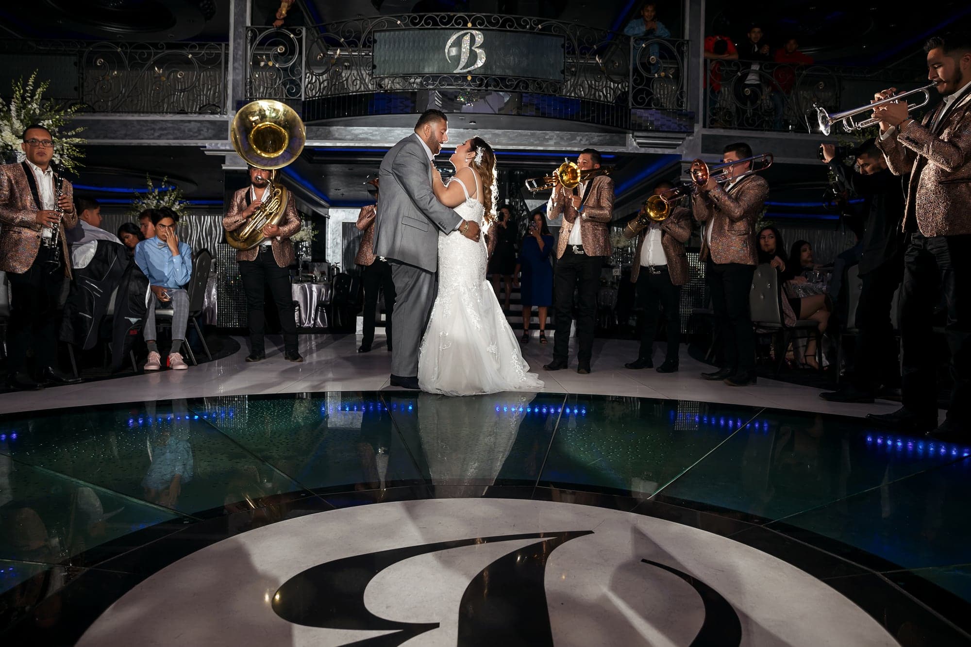 Francisco and Alejandra dancing while a live band performs