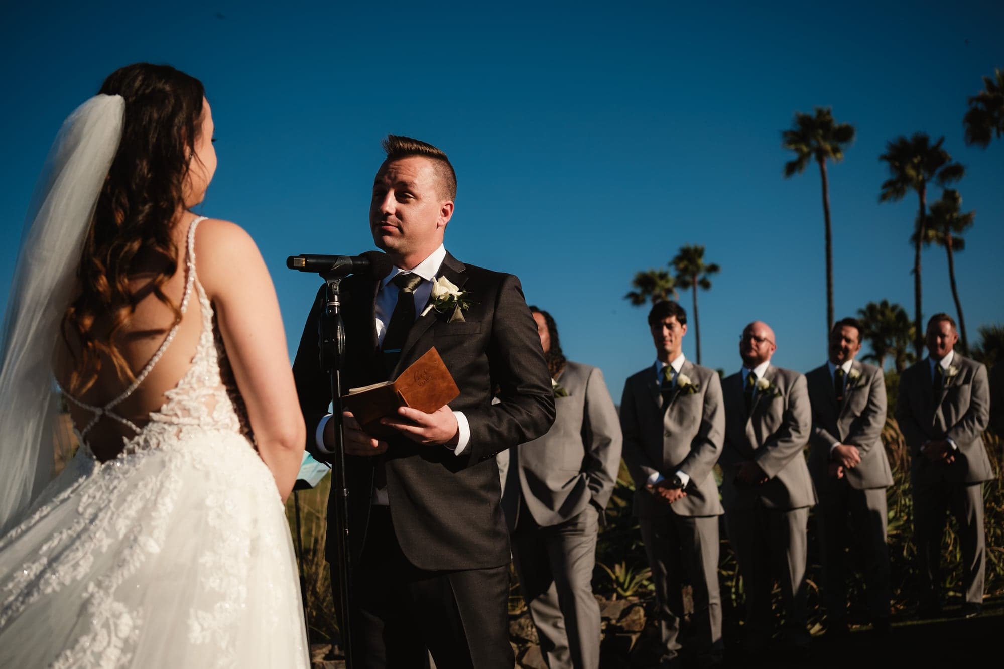 Leslie and Paul exchanging vows during their outdoor ceremony