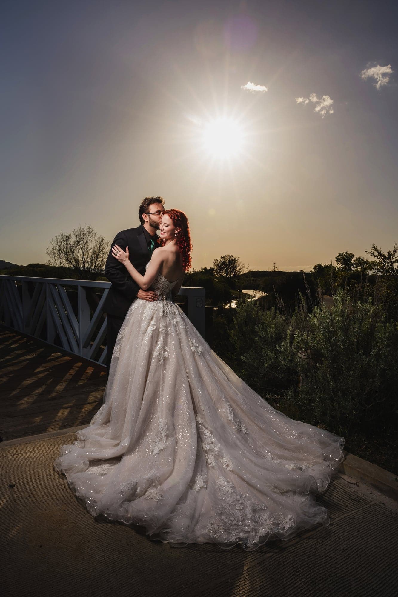 Maria and John standing together in warm sunset light