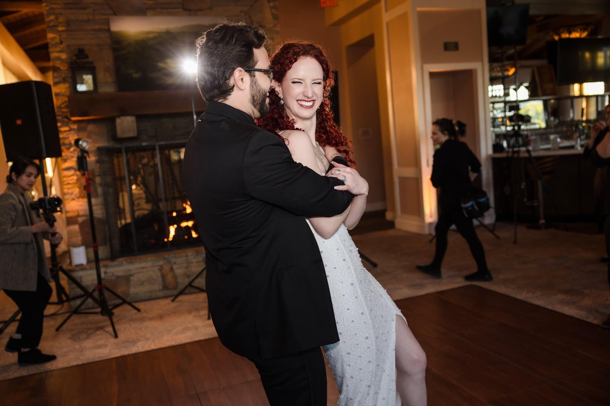 Maria and John dancing with guests at their reception