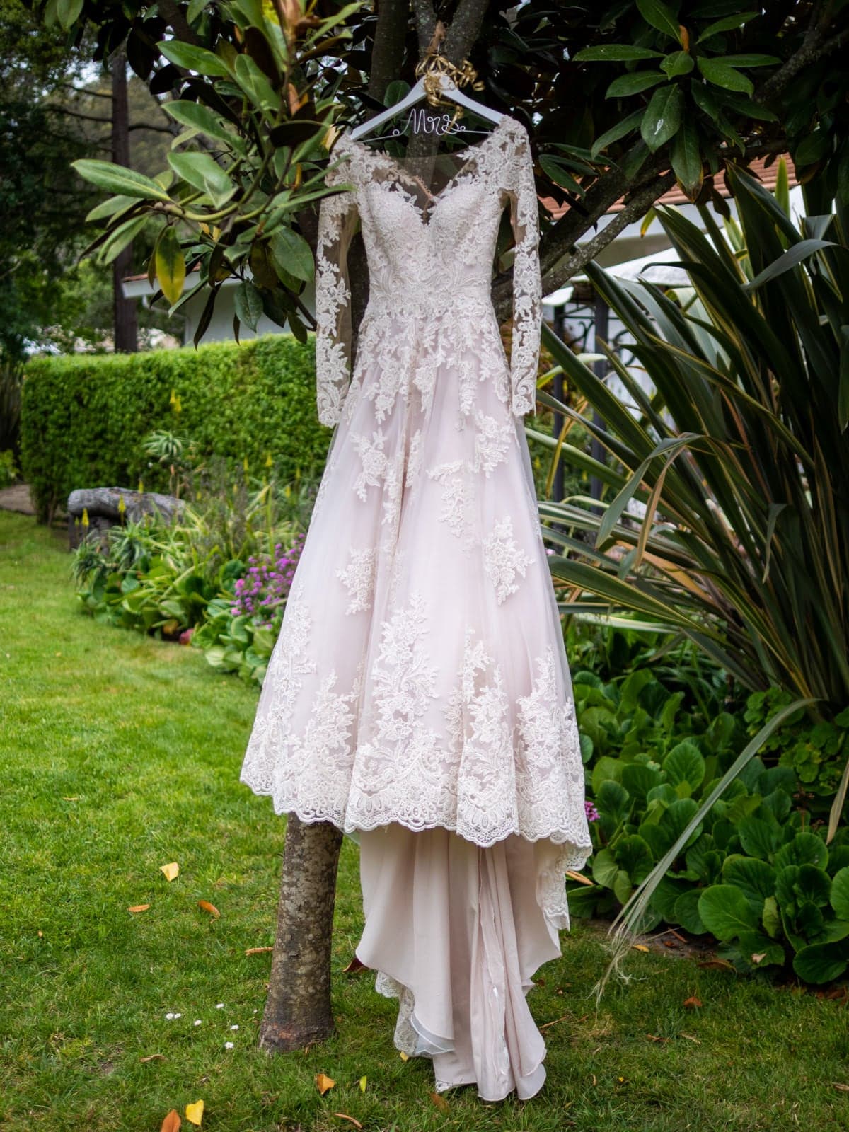 Lauren's lace wedding dress in the garden