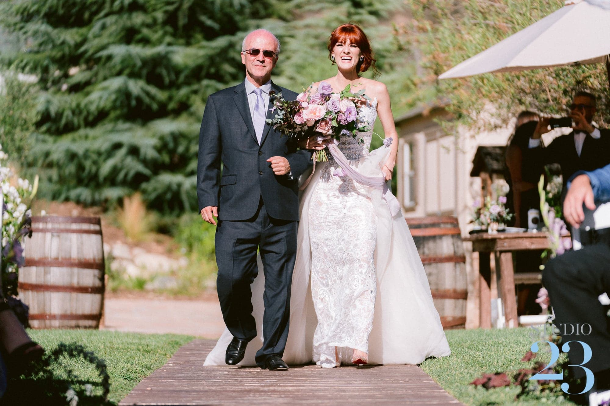 Ari walking into the garden ceremony