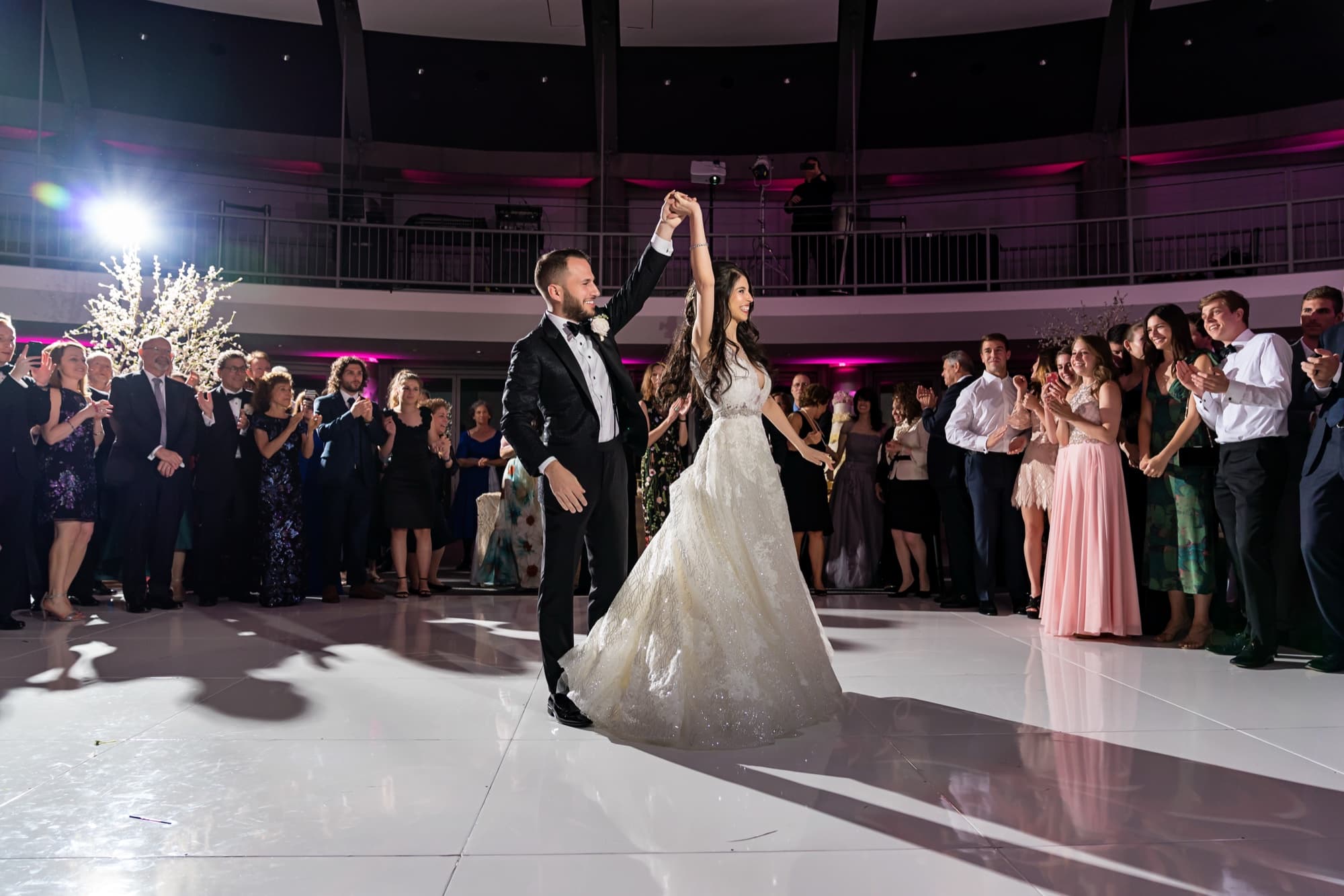 Rachel and Jeff's first dance alone on the white rotunda floor as guests circle the room