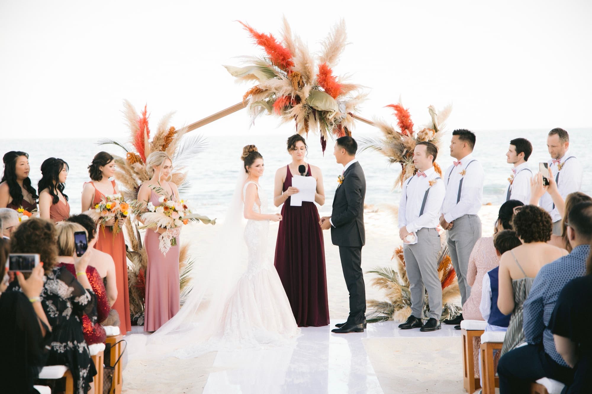 Groomsmen sliding across the dance floor on their knees as the party peaks
