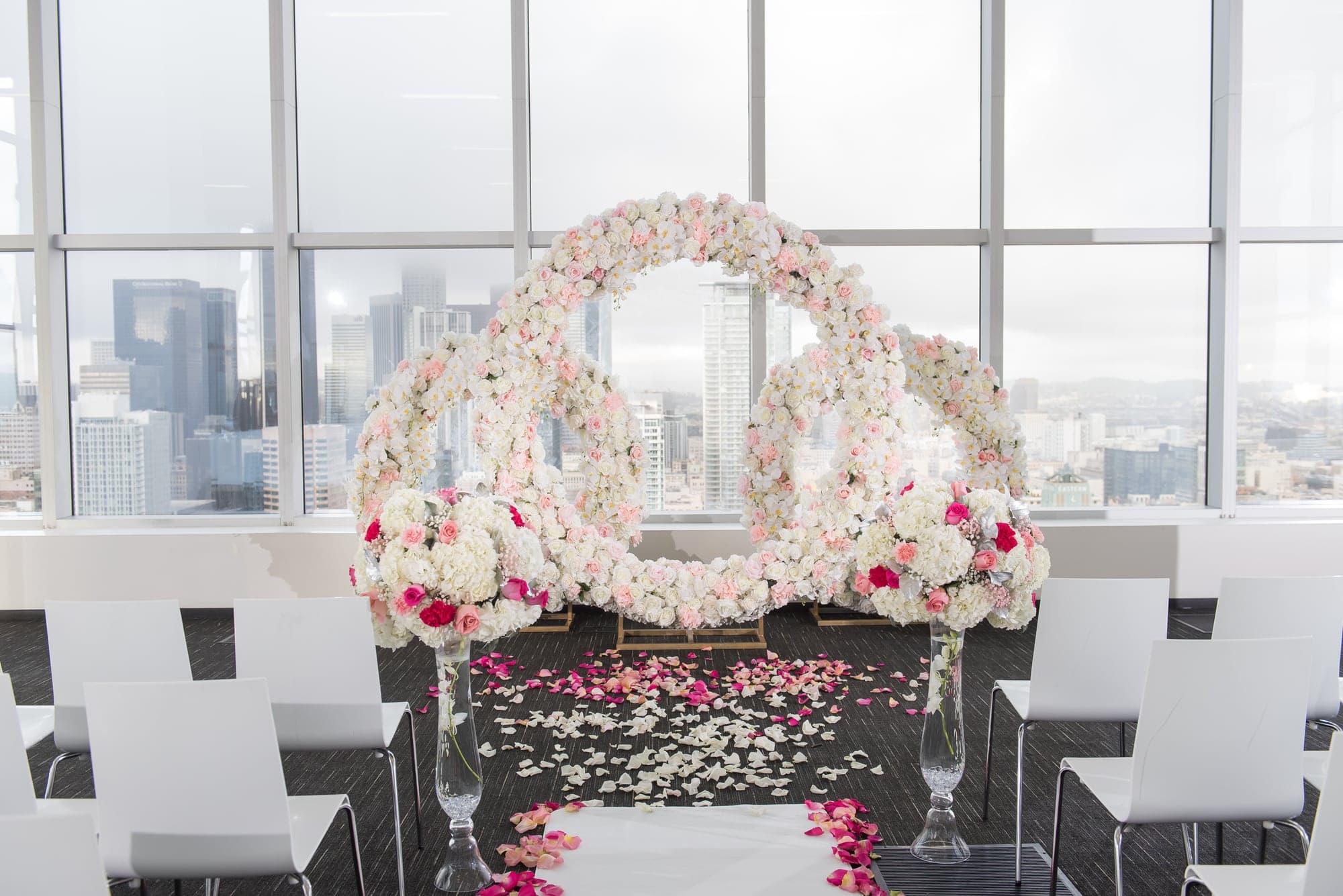 Blush floral ceremony design at South Park Center